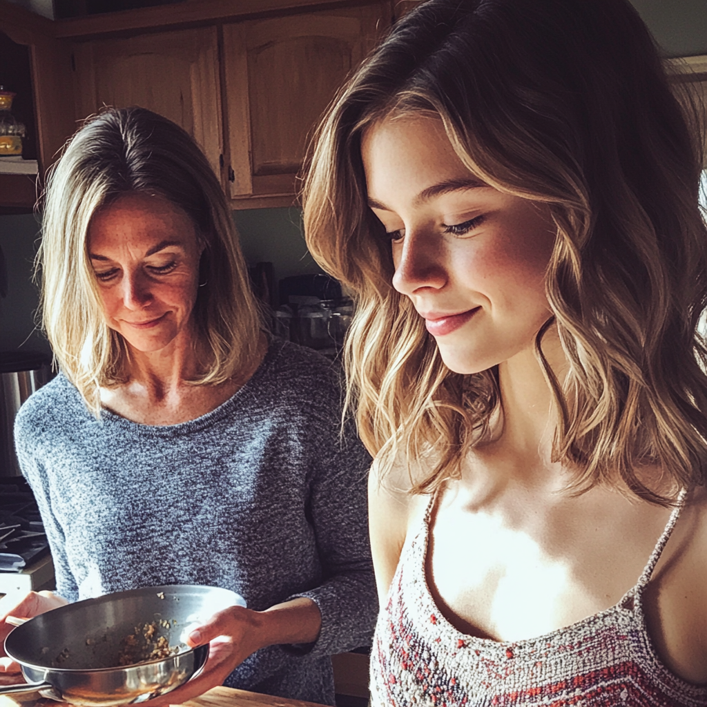 A mother and daughter duo in the kitchen | Source: no source