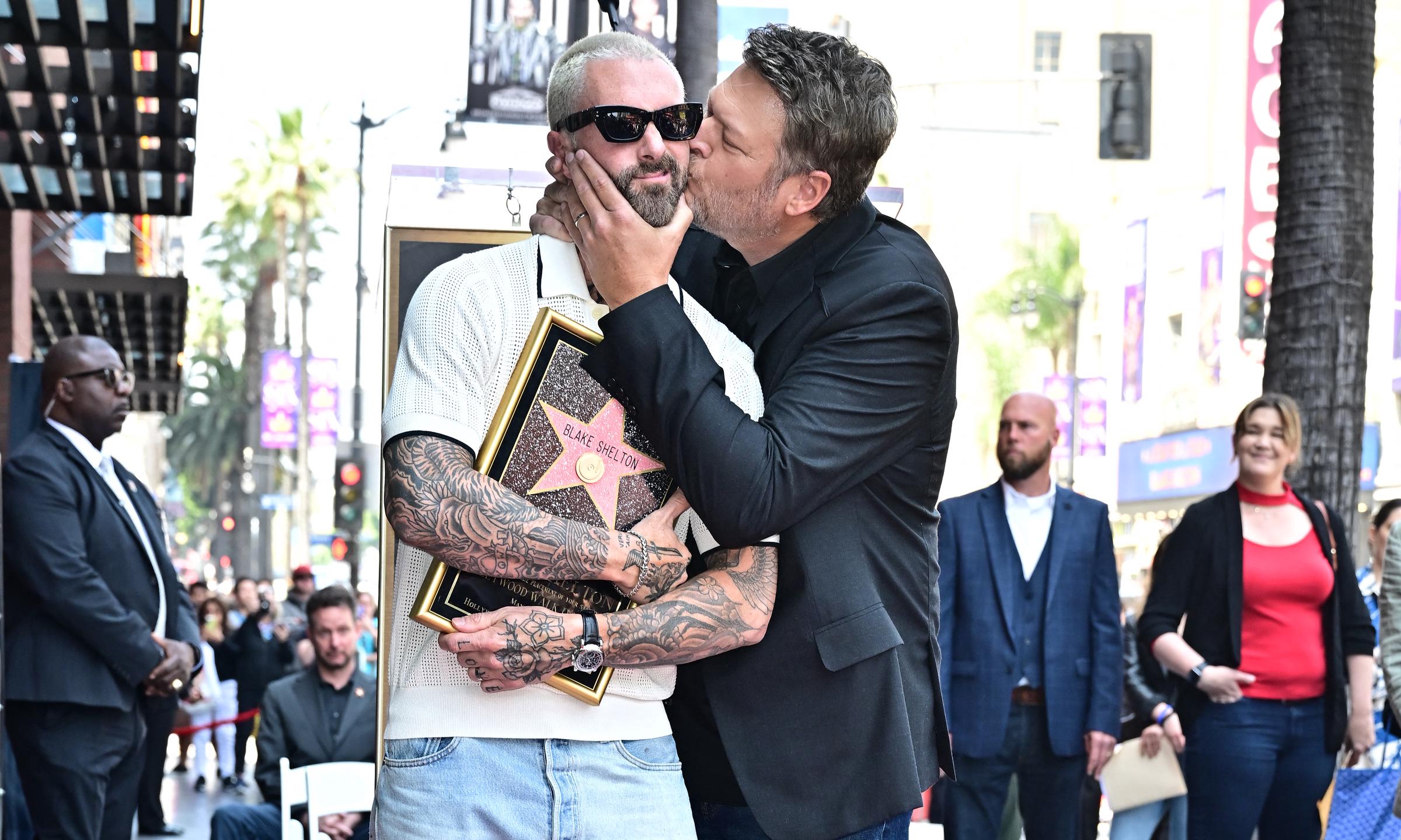 Adam Levine and Blake Shelton pose during Levine's Hollywood Walk of Fame Star ceremony on May 12, 2023 | Source: Getty Images