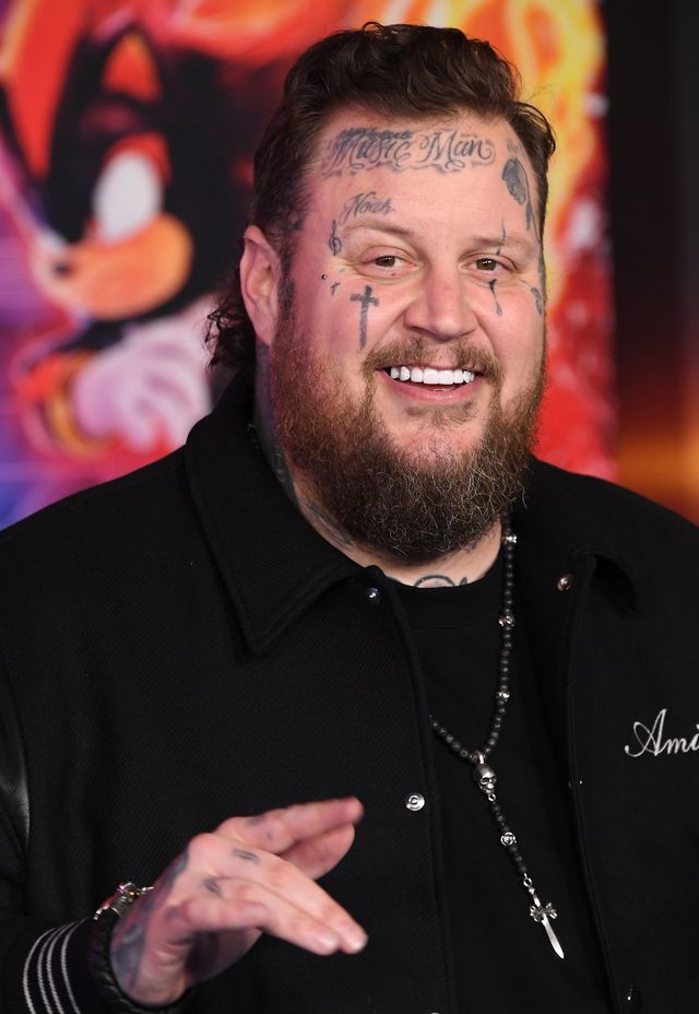 By December 16, 2024, Jelly Roll had already begun his weight loss journey, but still kept his beard long. He is pictured attending the premiere of "Sonic the Hedgehog 3" at TCL Chinese Theatre.