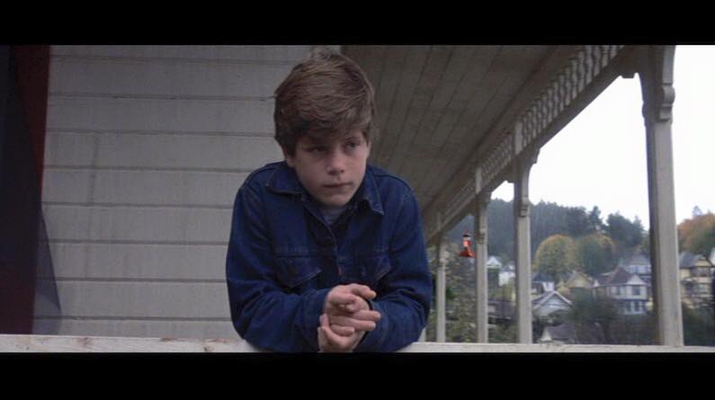Sean Astin is pictured on the porch of the hillside house in Astoria, Oregon where "The Goonies" was filmed, dated August 21, 2015 | Source: Facebook/SeanAstinPublic