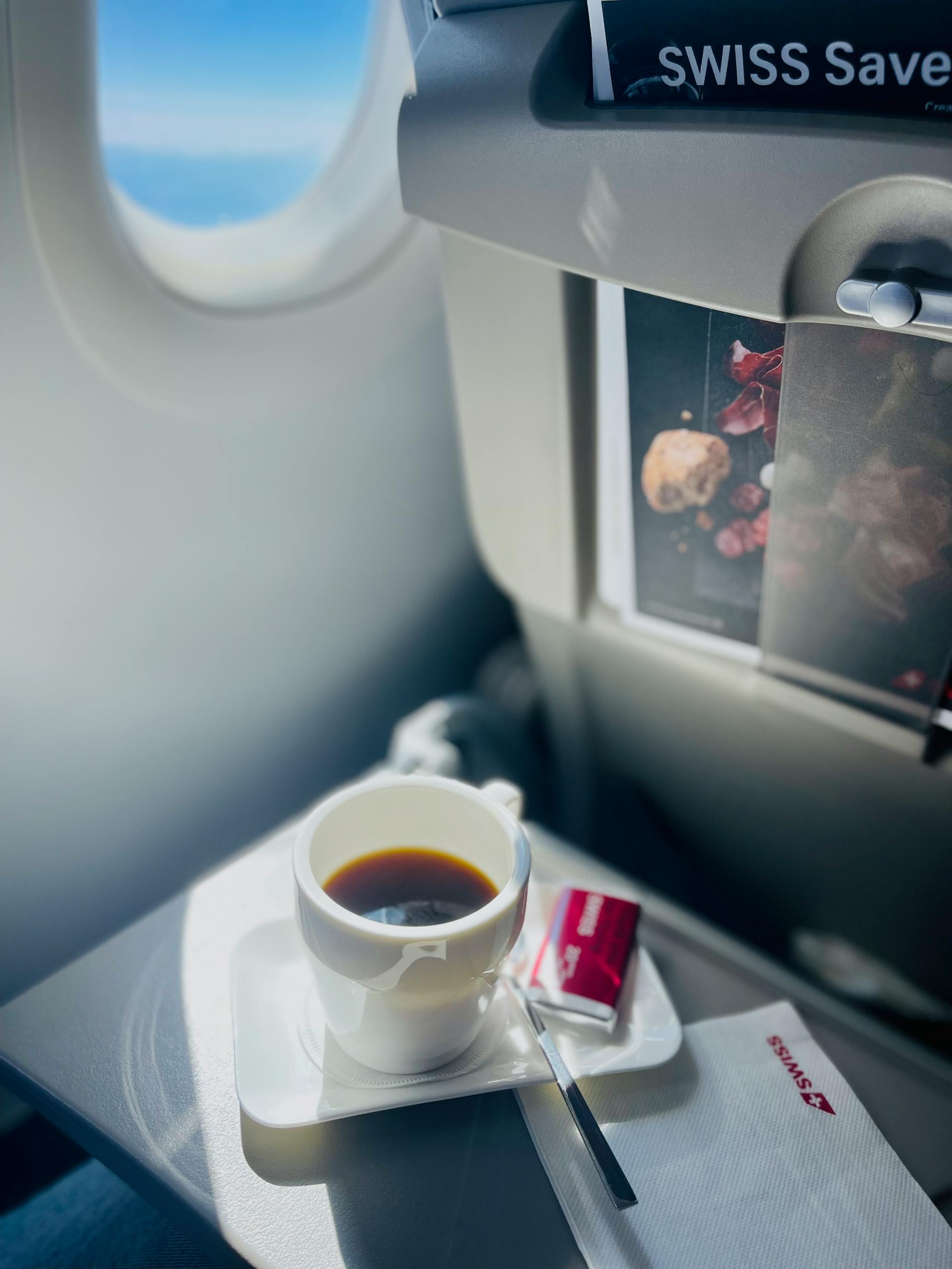 A cup of coffee in an airplane | Source: Pexels