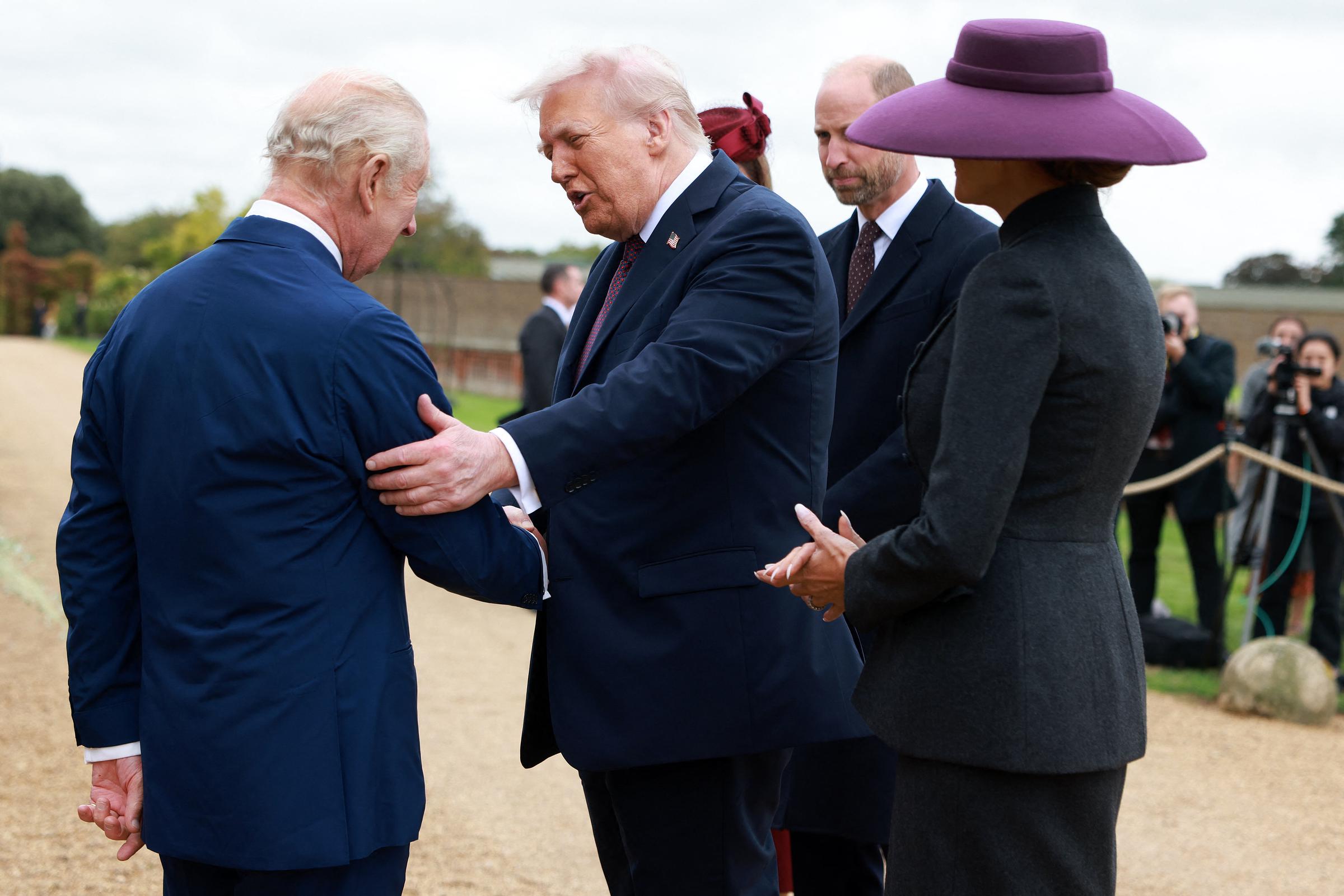 Britain's King Charles III greets US President Donald Trump and First Lady Melania upon their arrival at Windsor Castle in England on September 17, 2025 | Source: Getty Images