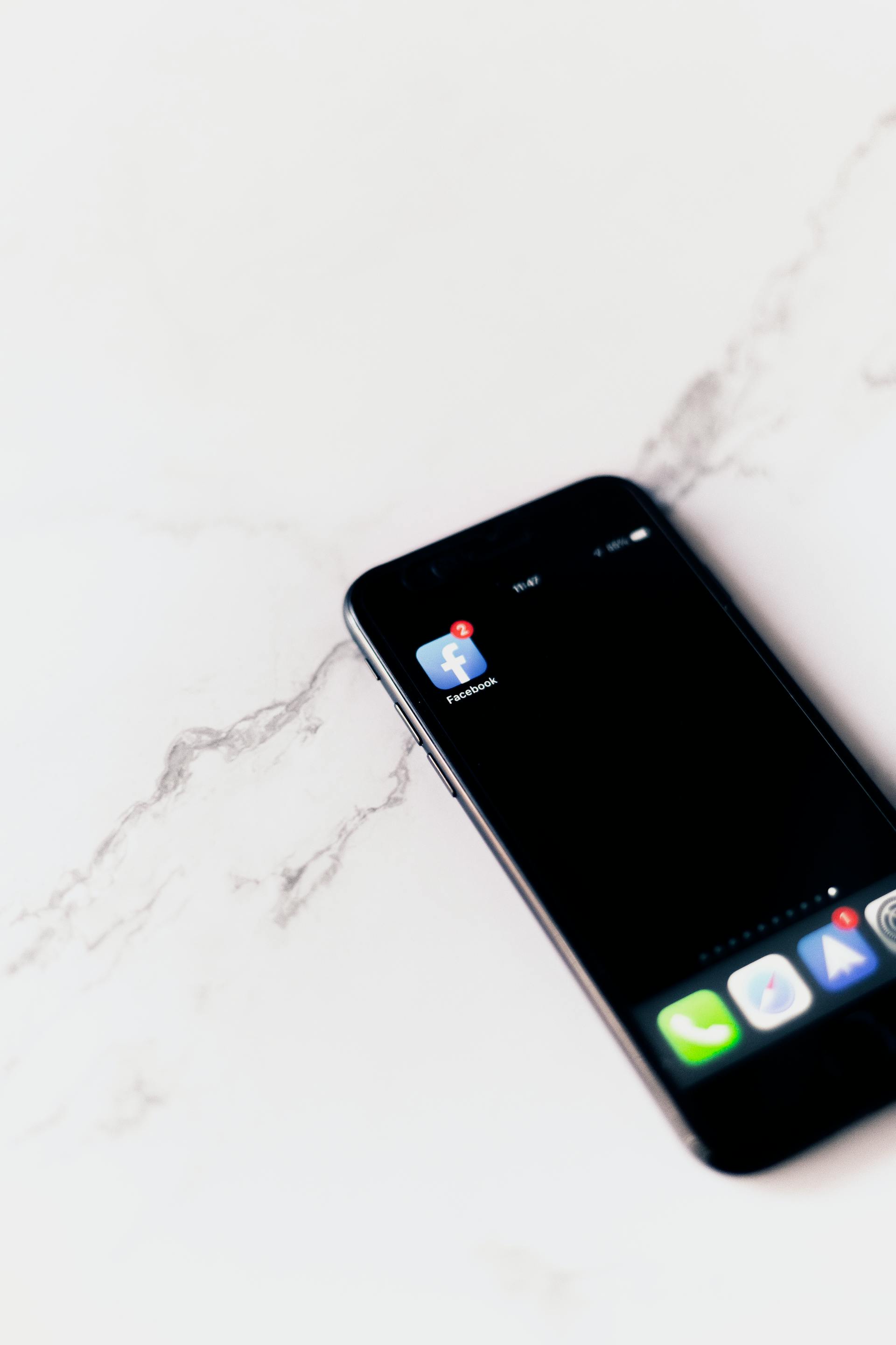 A cell phone with a Facebook icon on screen | Source: Pexels