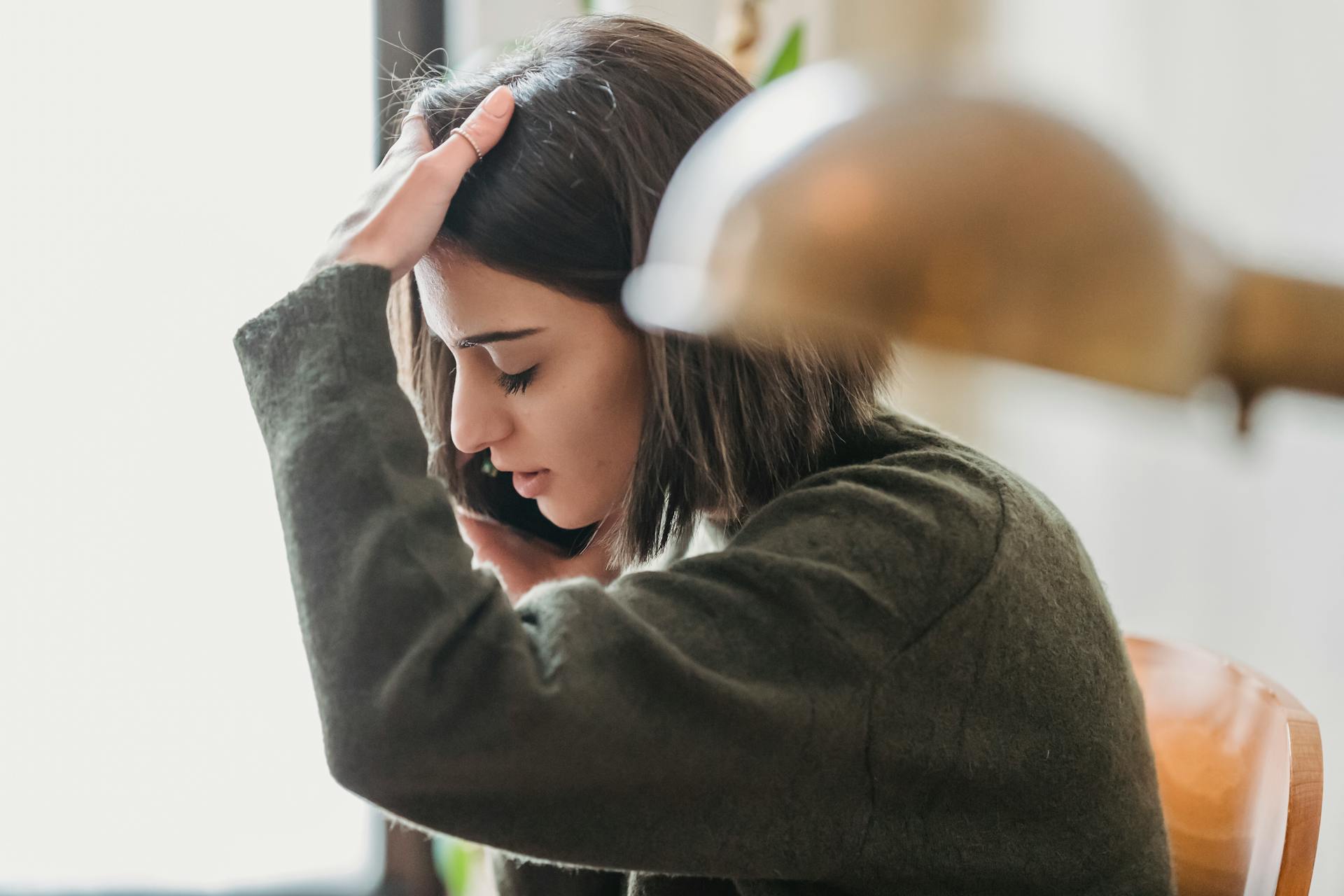 A tense woman making a phone call | Source: Pexels