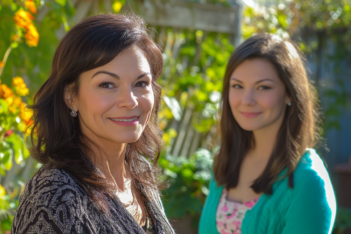 Two women standing in a back yard | Source:  no source