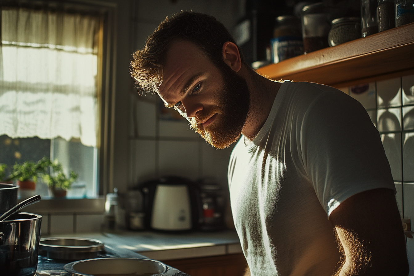 A man standing in the kitchen | Source: no source