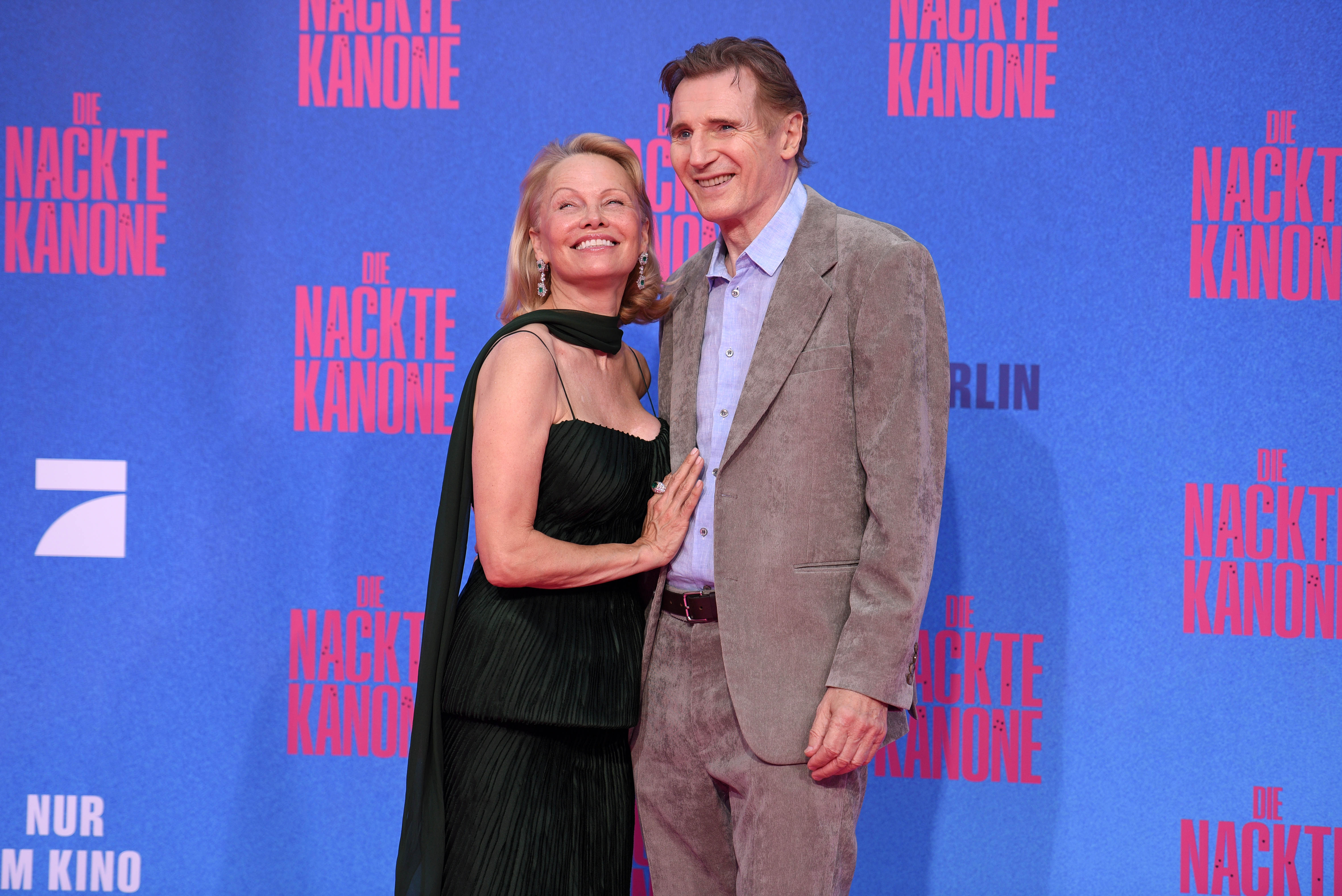 Pamela Anderson and Liam Neeson attend the Berlin premiere of the movie "The Naked Gun" at UCI Luxe East Side Gallery on July 24, 2025 in Berlin, Germany. | Source: Getty Images
