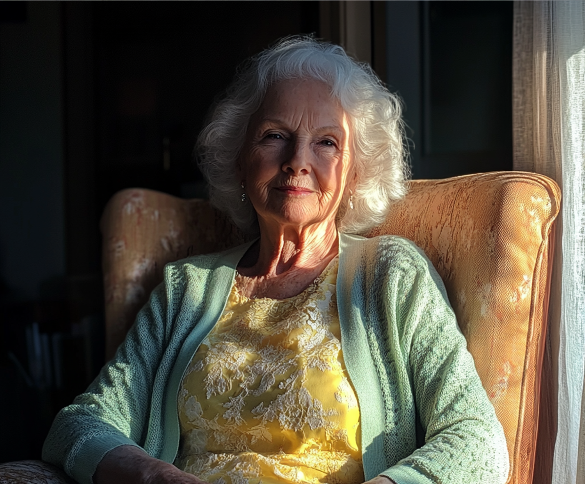 An older woman sitting by a window | Source: no source