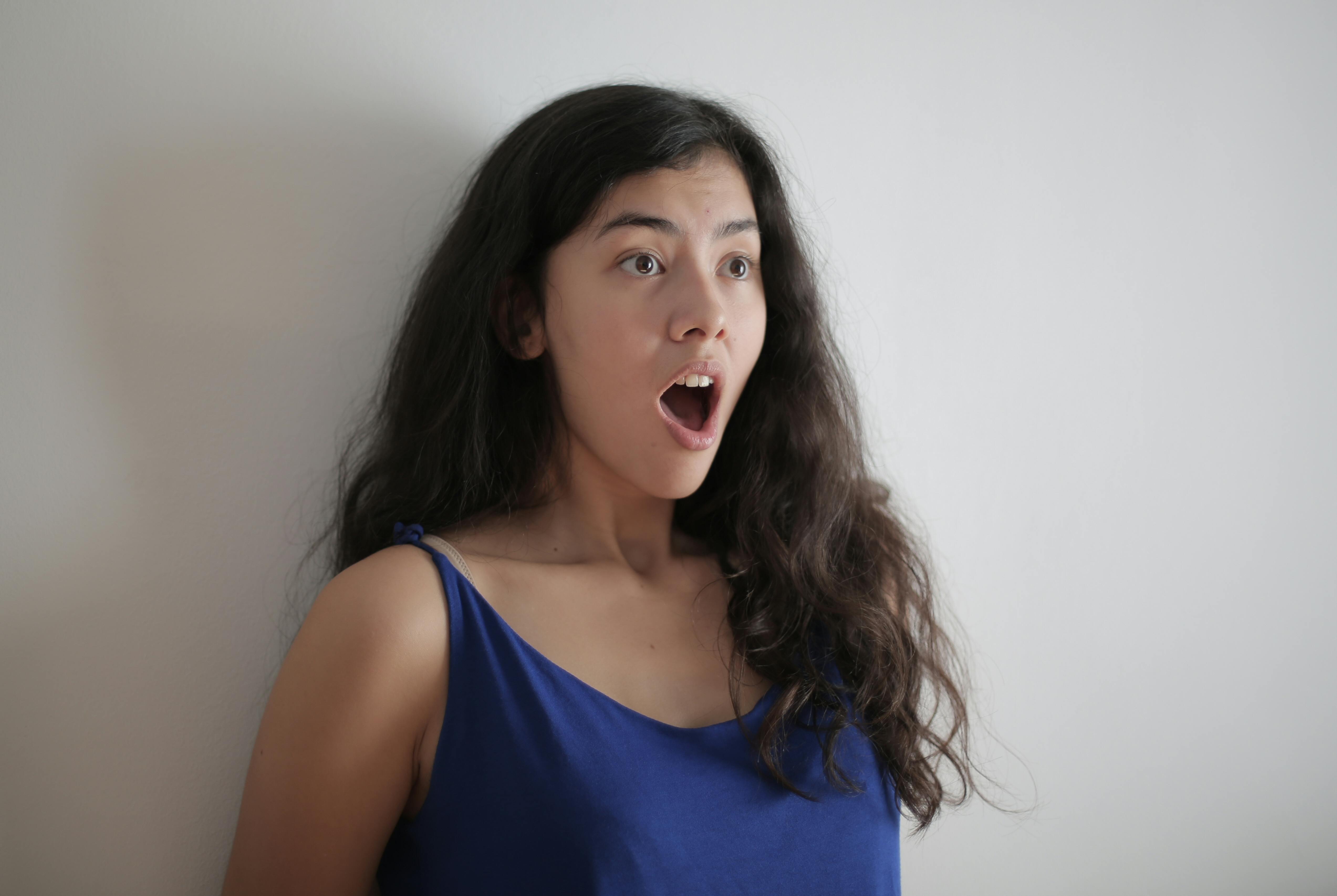 Shocked young woman close-up