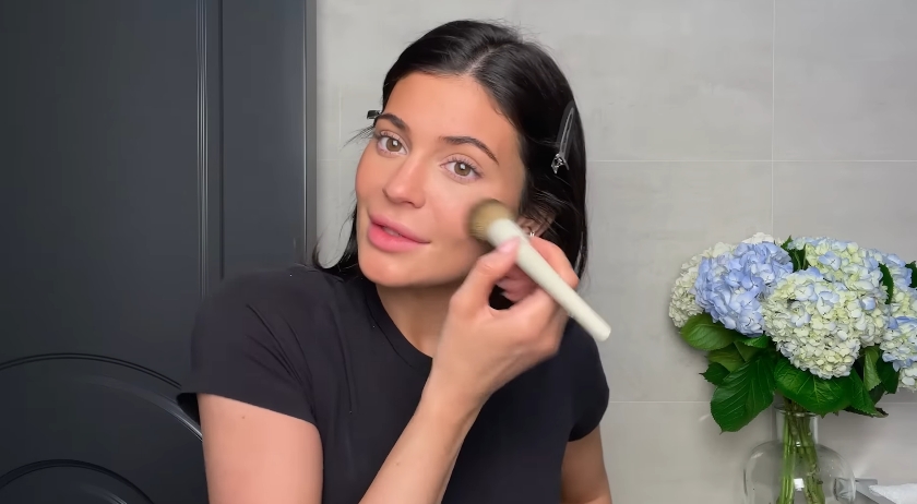 Kylie Jenner doing her classic beauty routine from a video dated April 6, 2023. | Source: YouTube/Vogue