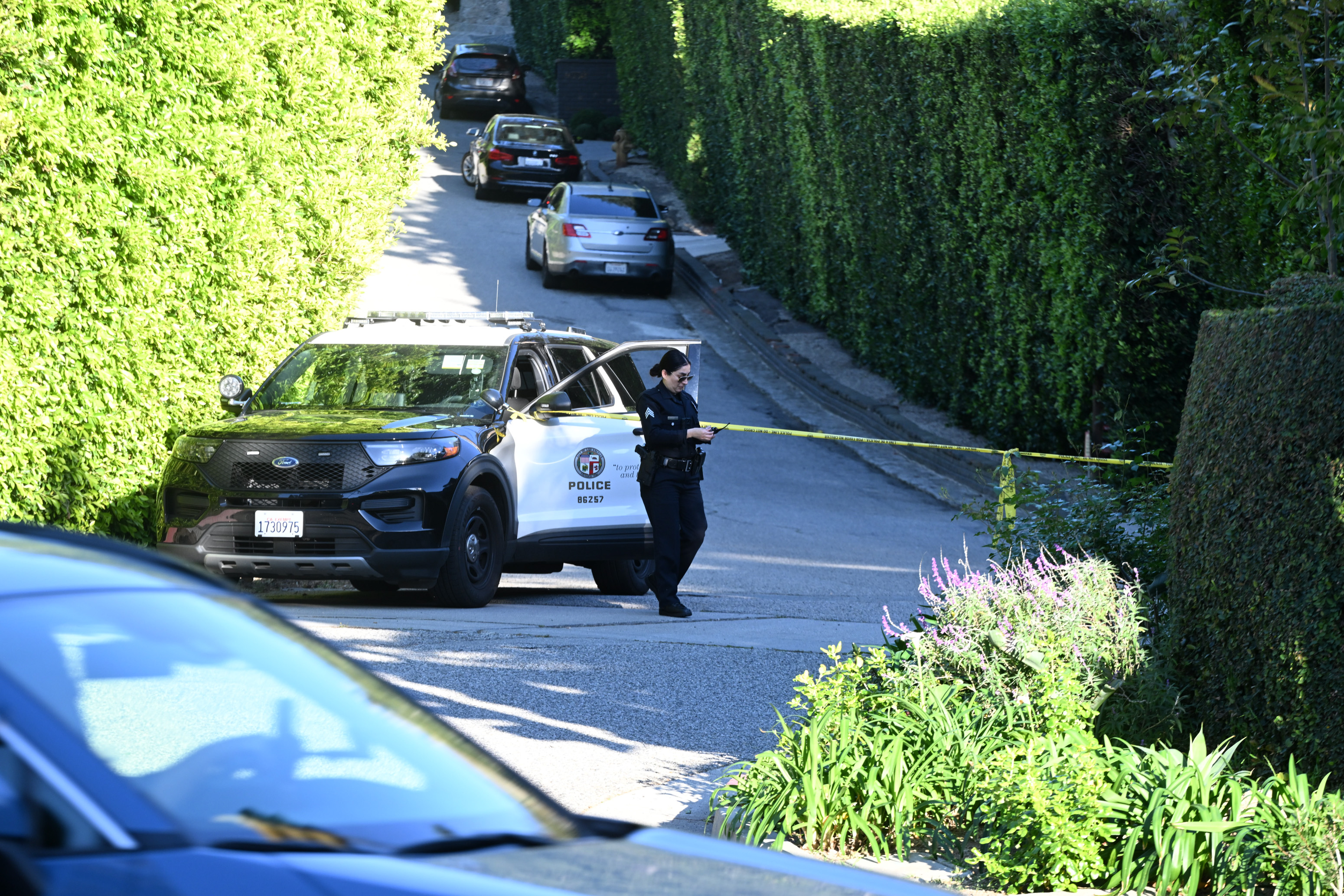 A police officer is seen outside of Rihanna's Beverly Hills home after a report of gun shots fired on March 8, 2026 in Los Angeles, California | Source: Getty Images