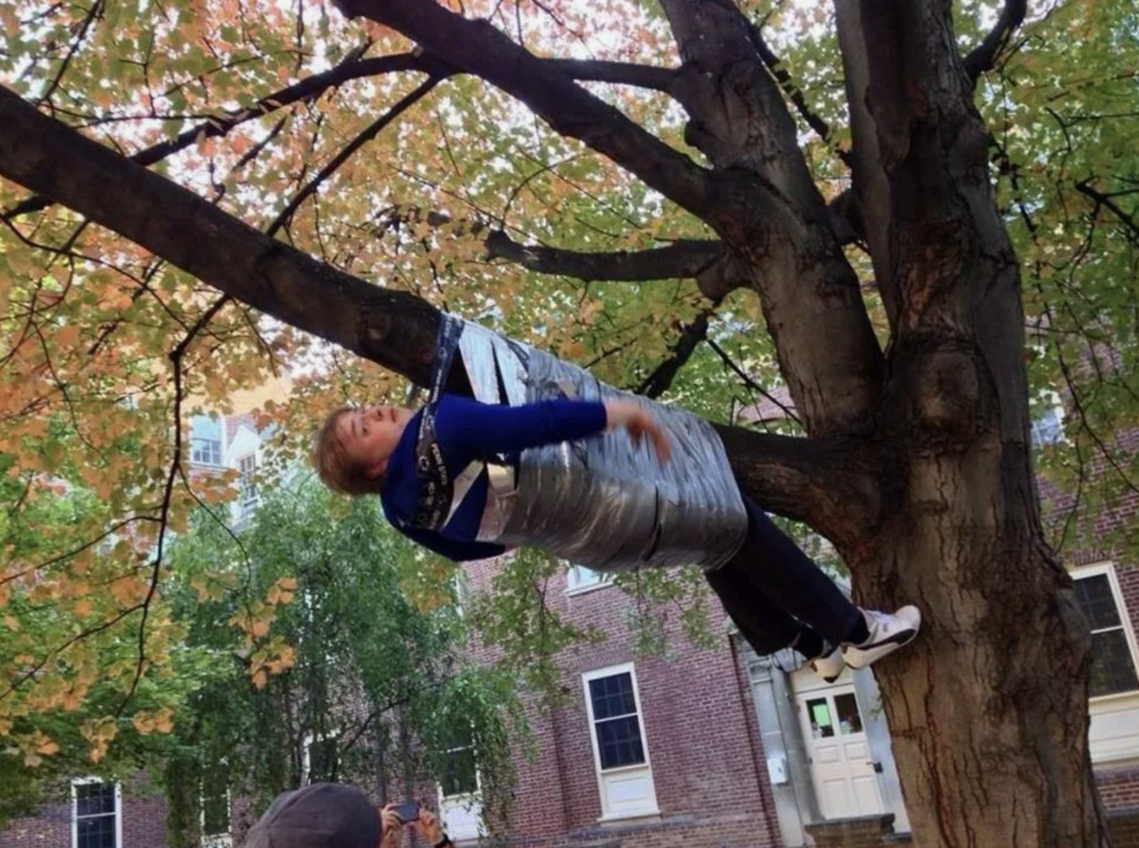 Guy tied to the tree | Source: Shutterstock