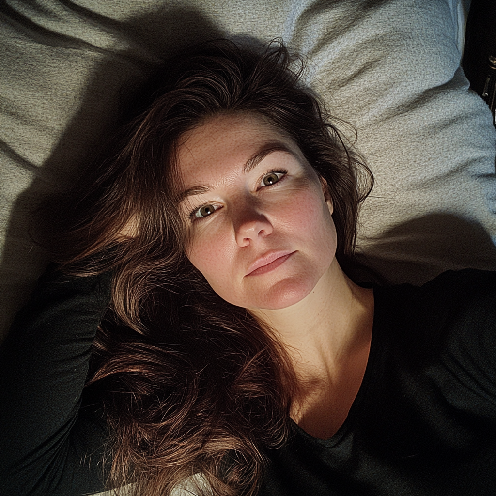 A woman lying in her bed | Source: No source