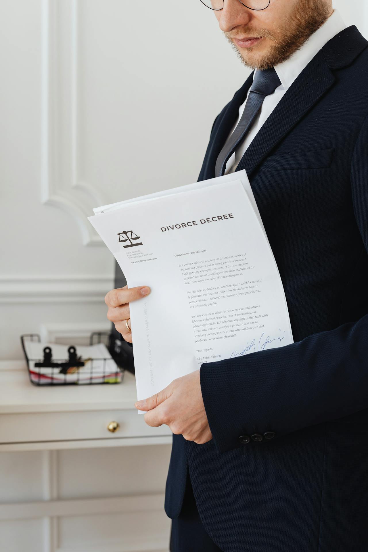An attorney holding divorce documents | Source: Pexels