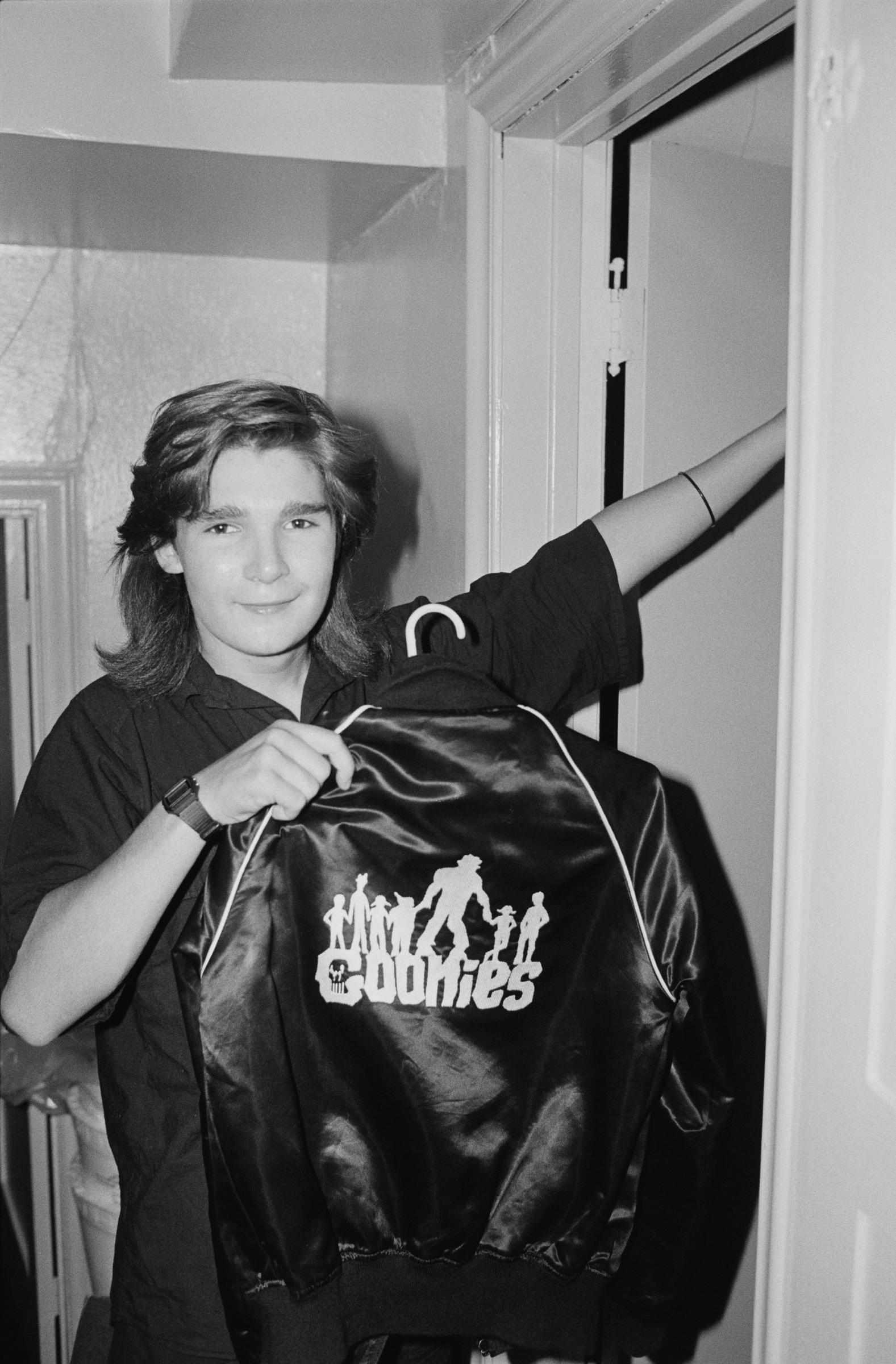 Corey Feldman poses with a jacket branded with "The Goonies" on the back in 1985 | Source: Getty Images