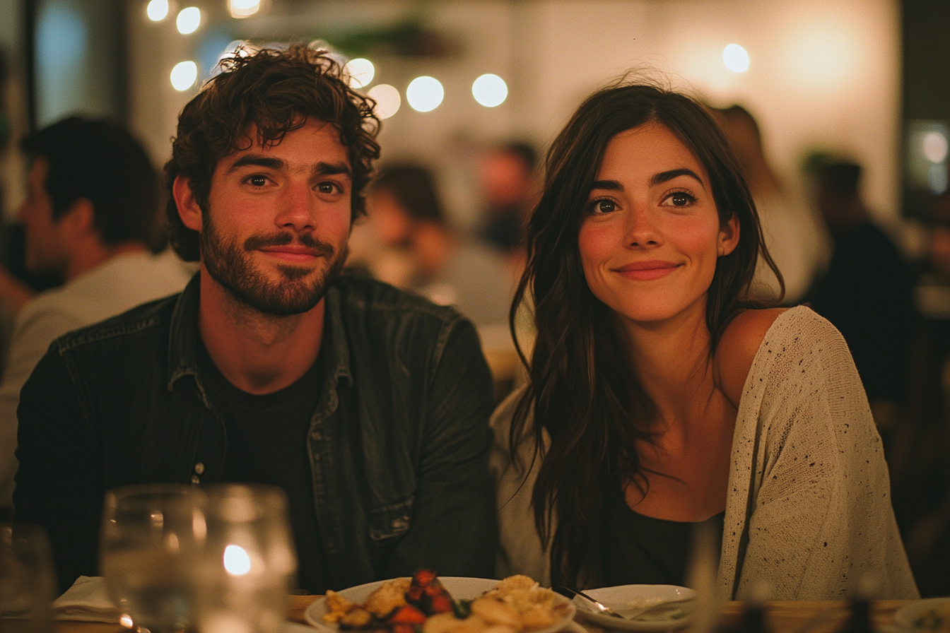 Couple seated at a dinner table | Source: no source