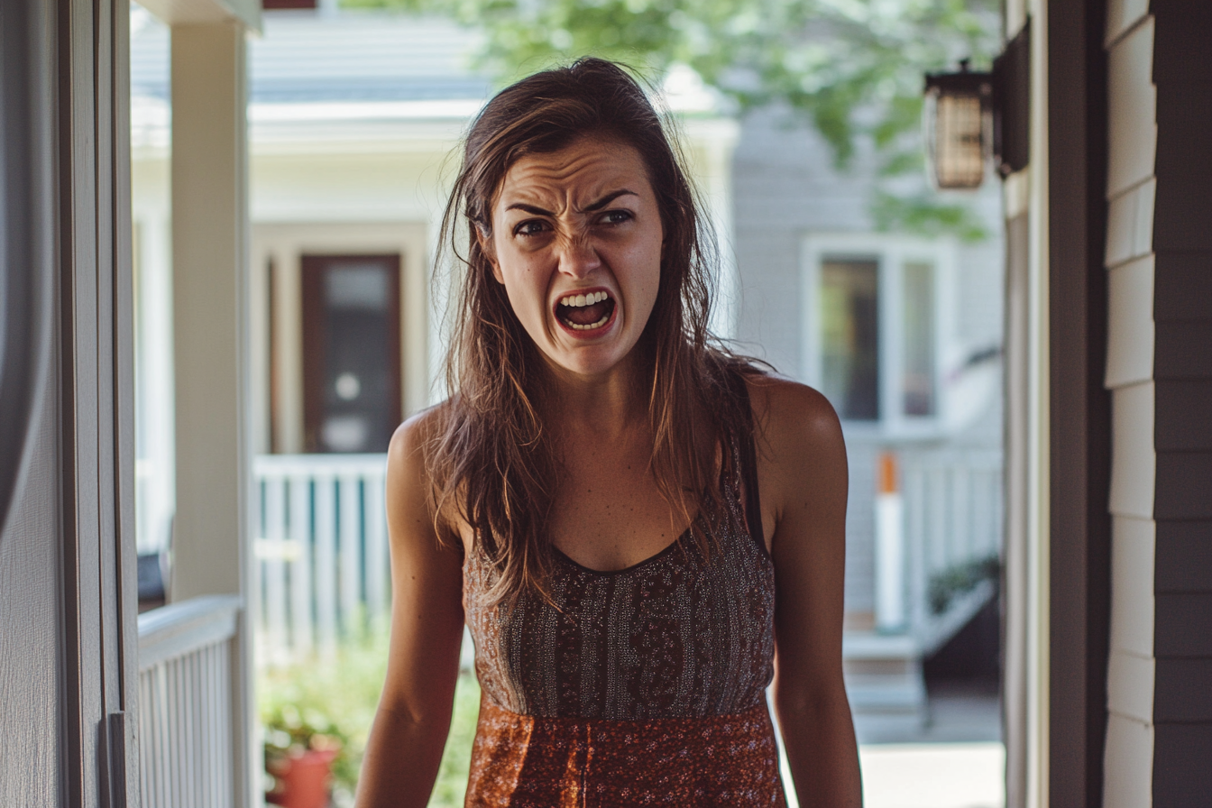 A woman standing on a porch yelling at someone | Source: no source