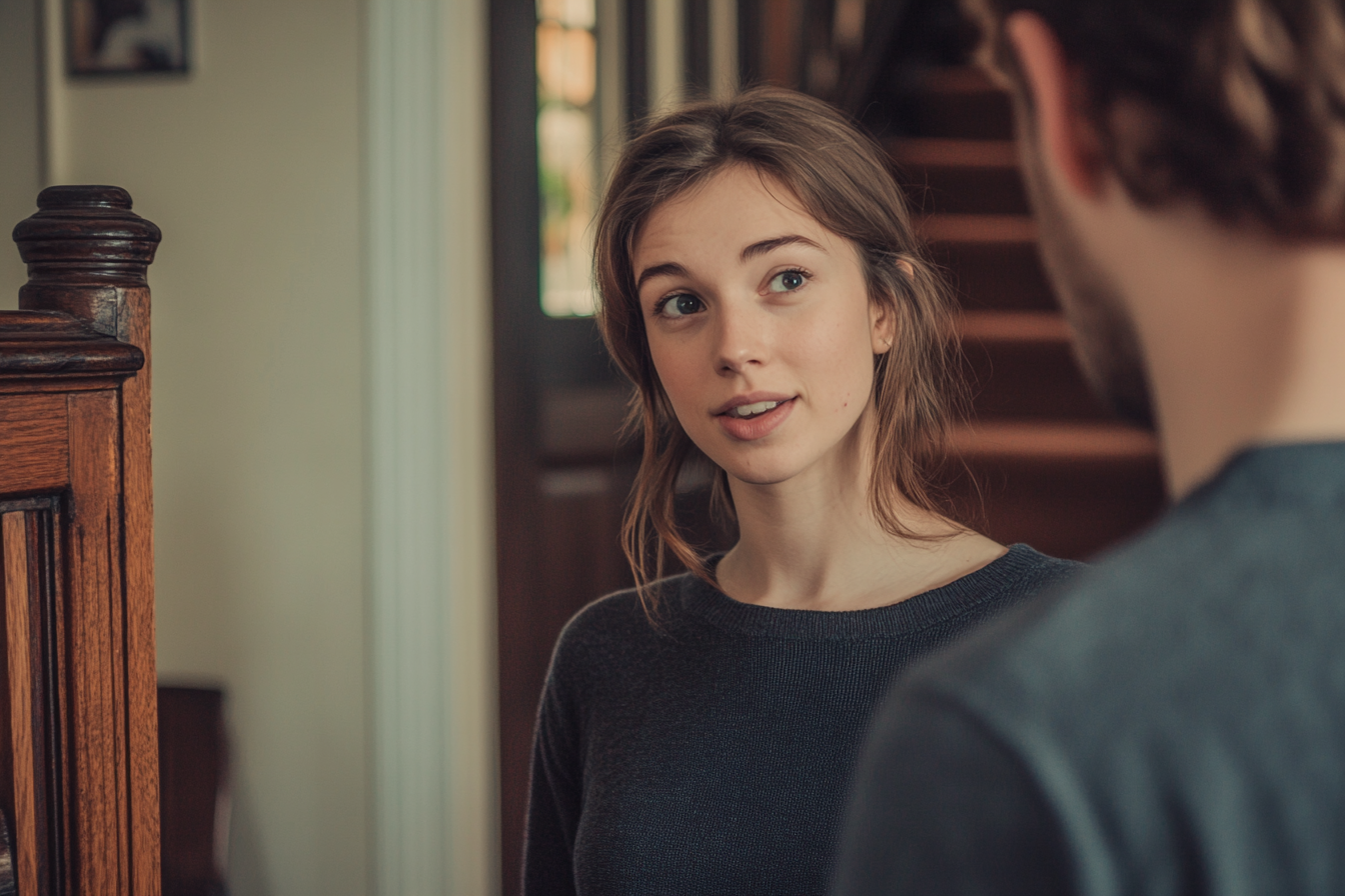 A woman answering her front door | Source: no source
