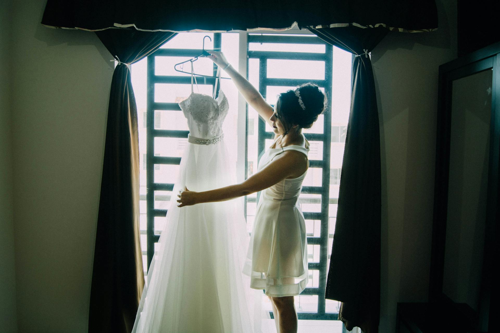 A woman admiring a wedding gown | Source: Pexels