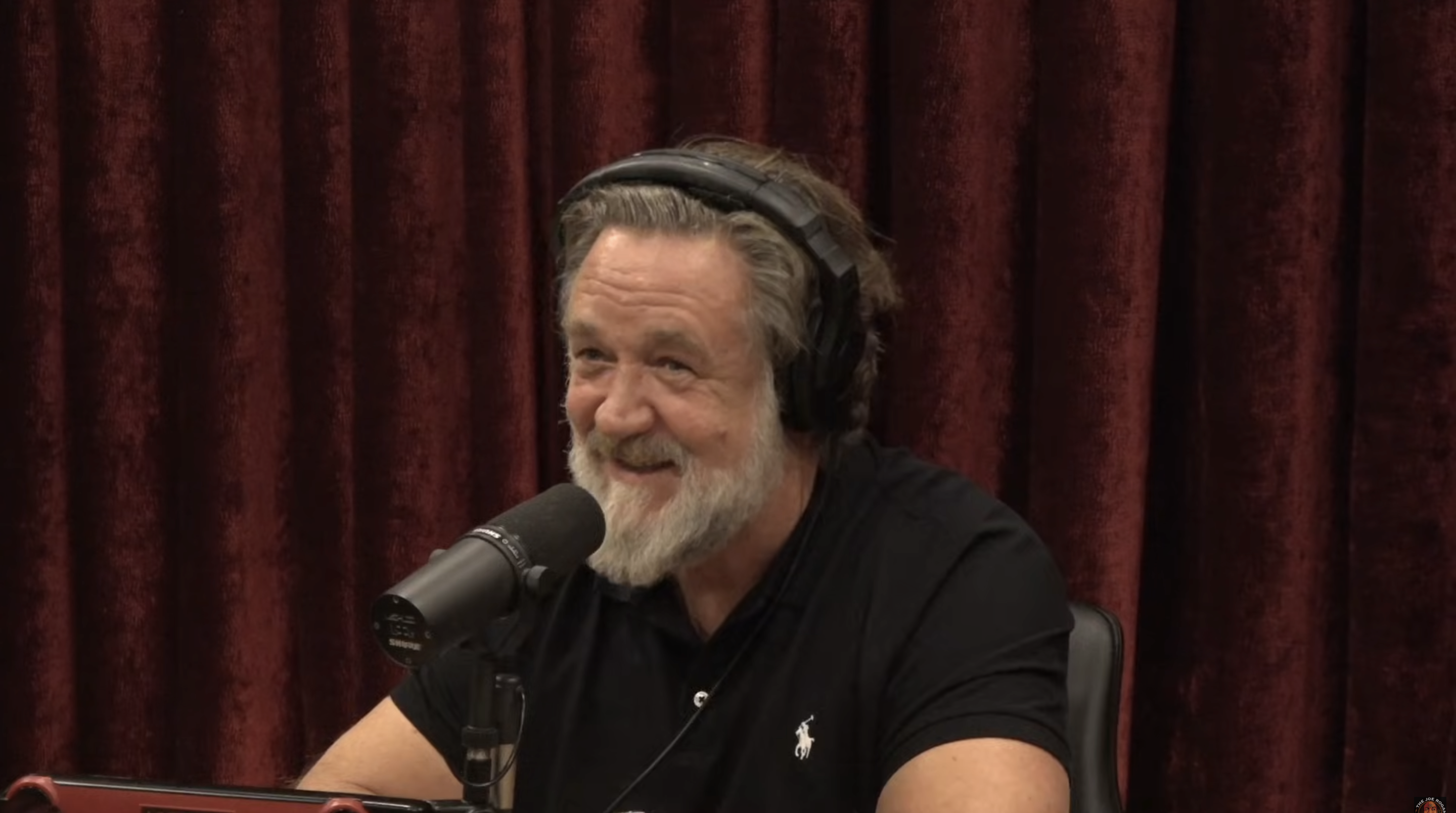 During his November 5, 2025, appearance on "The Joe Rogan Experience," Russell Crowe shared a laugh mid-conversation, looking noticeably leaner and more at ease. The interview marked his first public acknowledgment of the medical treatments and lifestyle changes behind his striking transformation. | Source: YouTube/PowerfulJRE