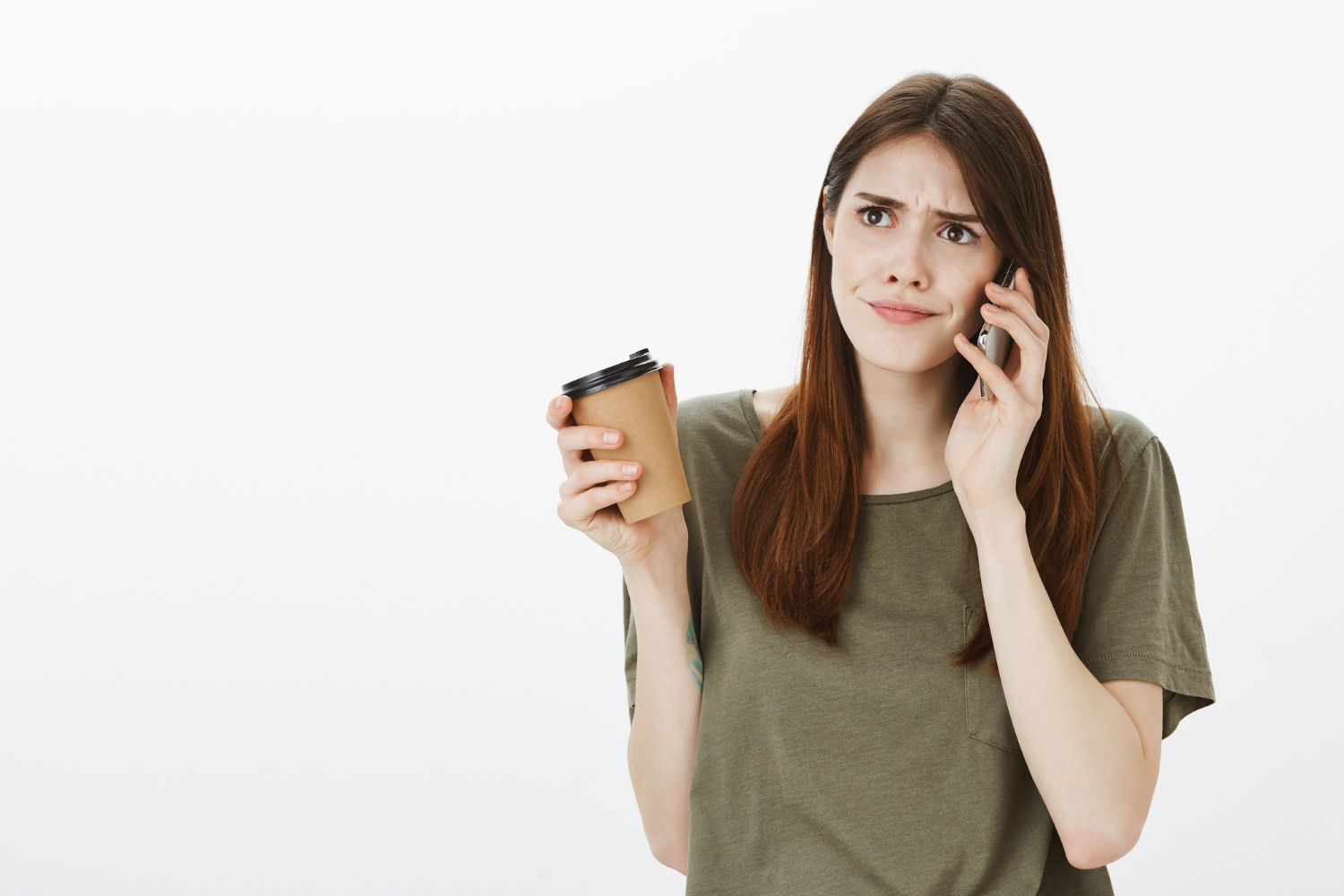 An annoyed woman engaged on a phonecall | Source: Freepik