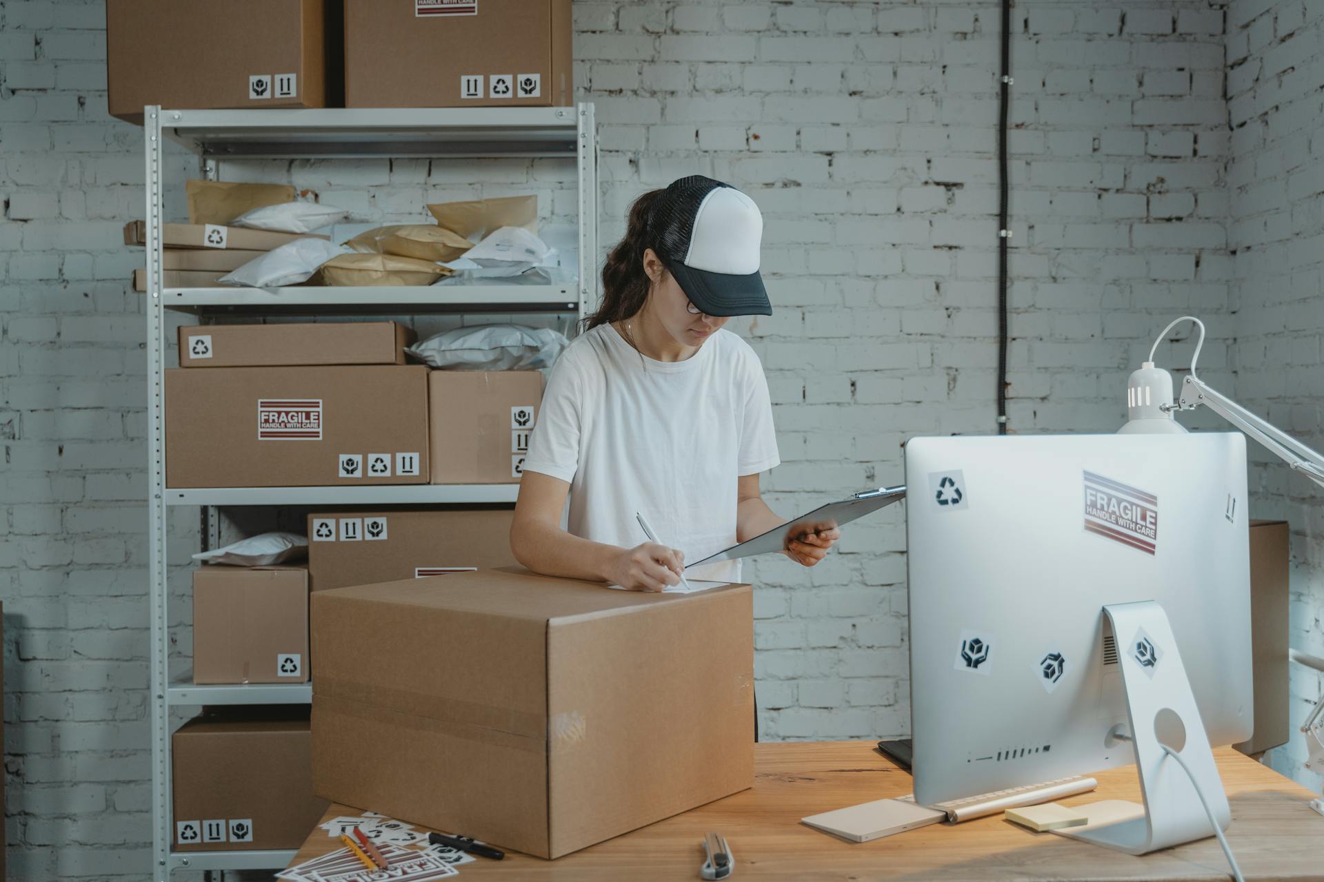 A woman working in a warehouse office | Source: Pexels
