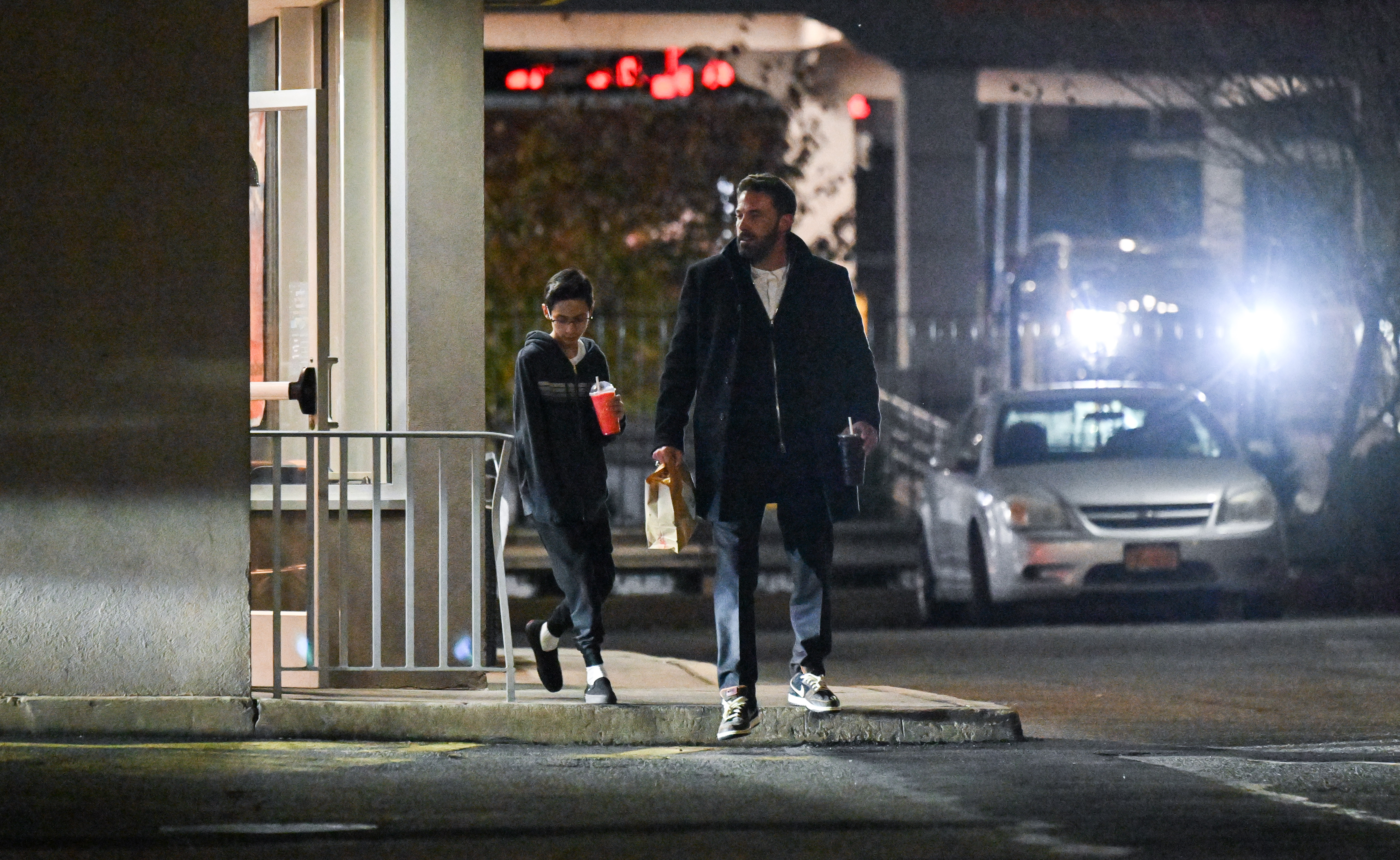 Maximilian David Muniz and Ben Affleck visit McDonald's in Maspeth on November 25, 2022 | Source: Getty Images