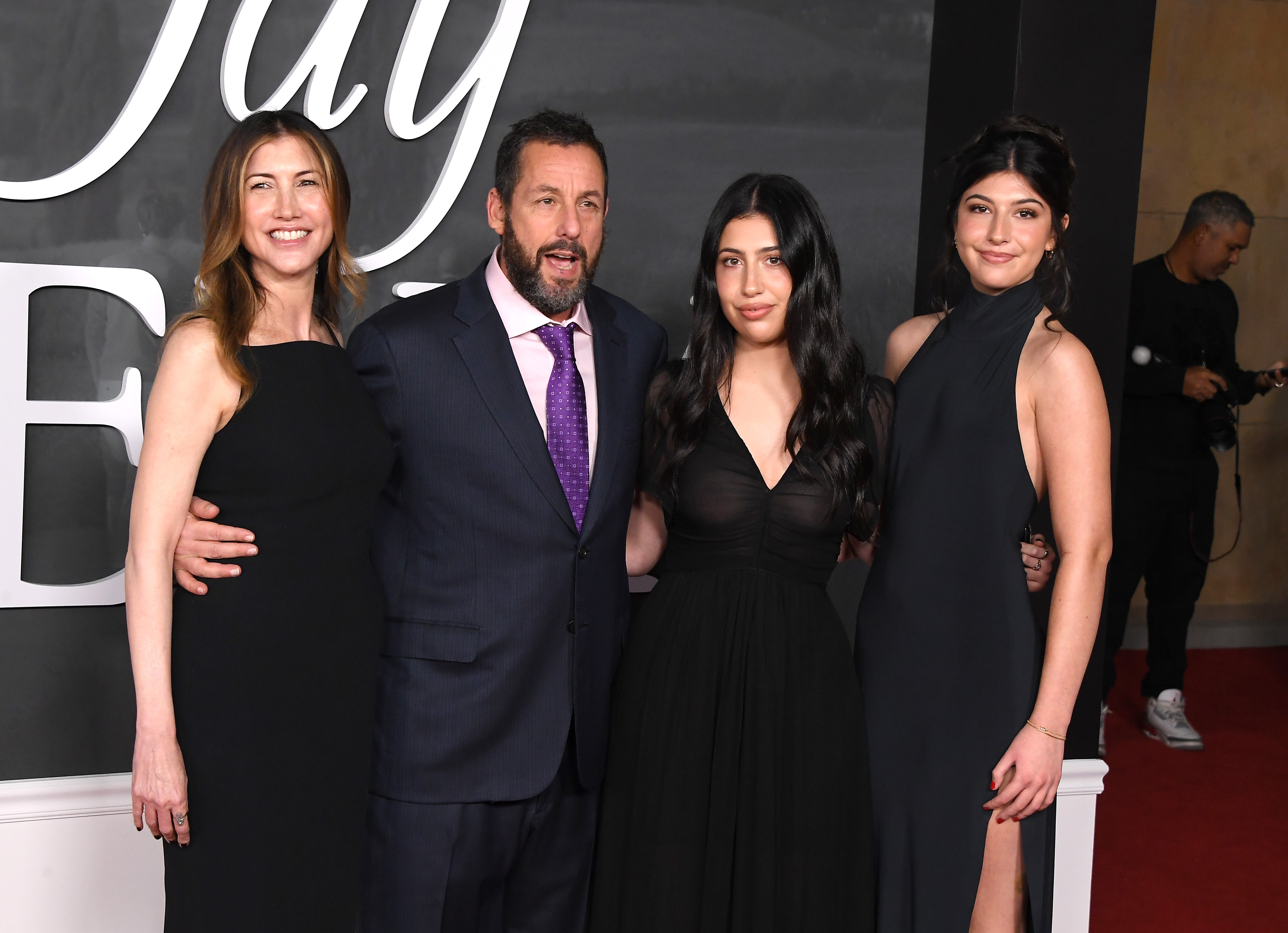 Jackie, Adam, Sadie, and Sunny Sandler look gorgeous in their coordinated outfits at the "Jay Kelly" premiere. Their appearance is both a show of support for Adam and a sweet moment for Sadie, who stars alongside her father in the film.