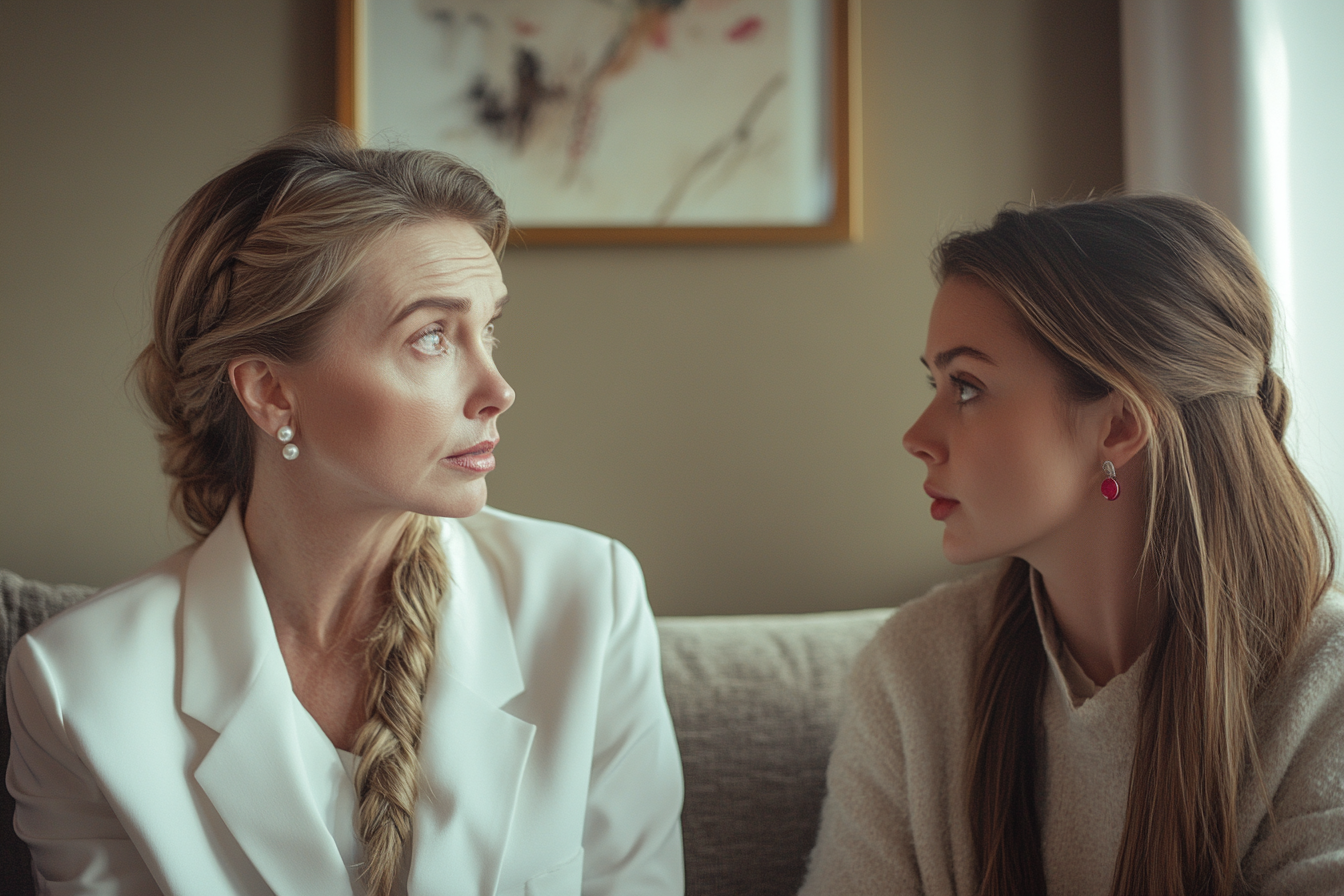 A mother and daughter having a serious talk on a couch | Source: No source