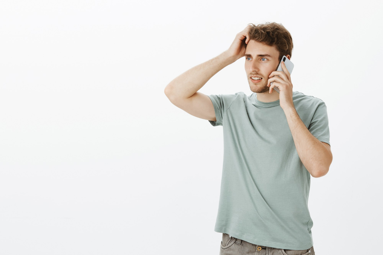A confident man talking on the phone | Source: Freepik