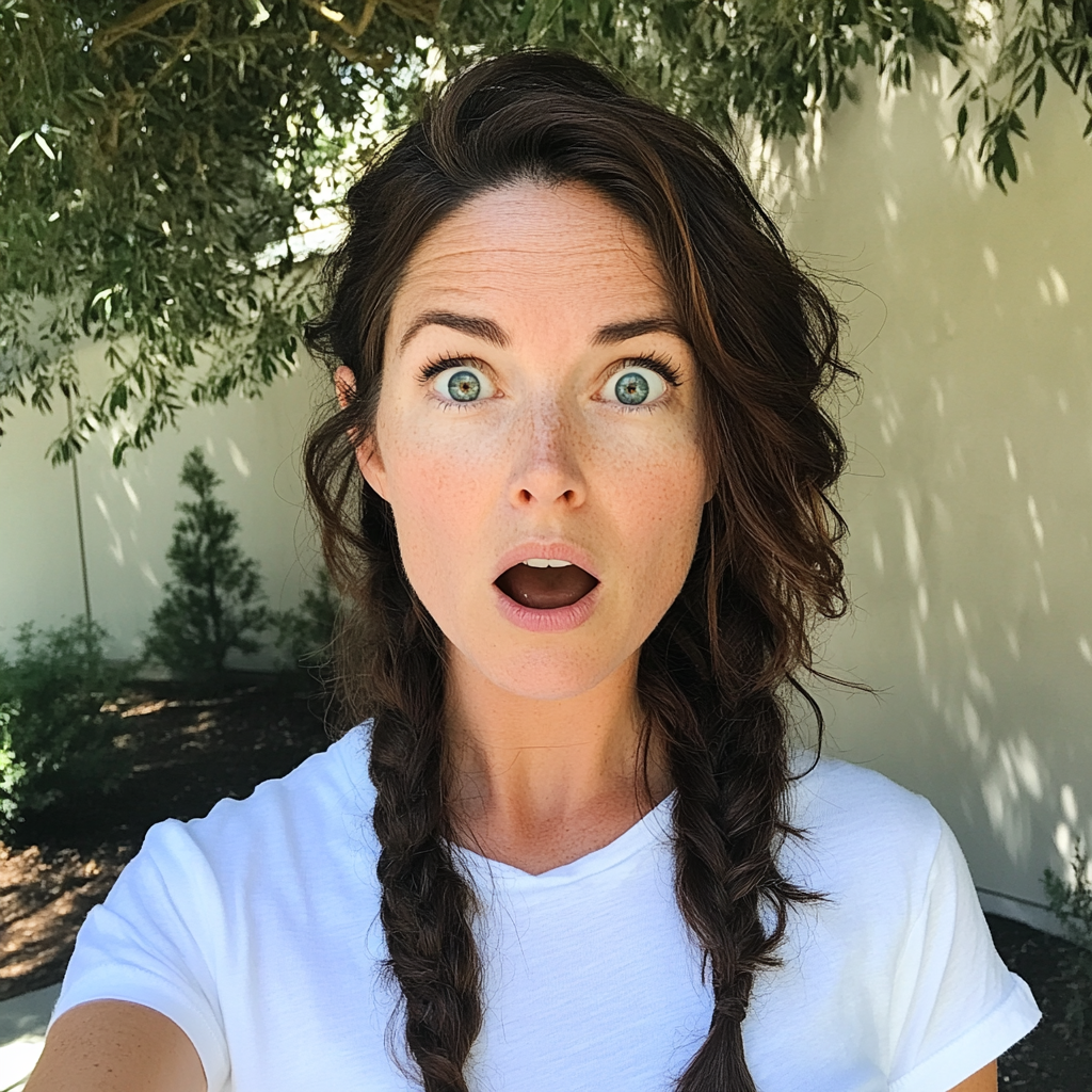 A shocked woman with braided hair | Source: No source
