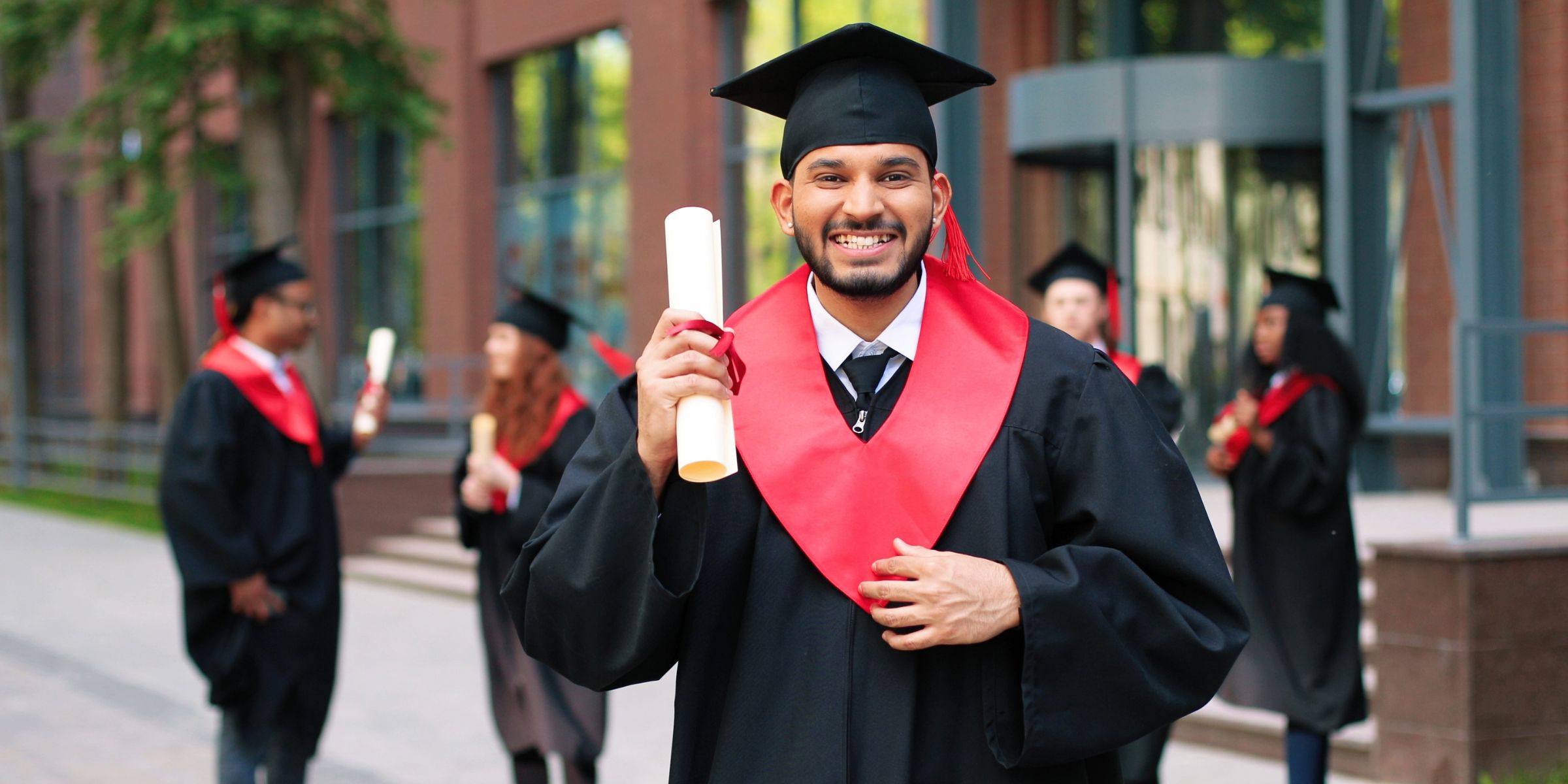 A young man at graduation | Source: Shutterstock