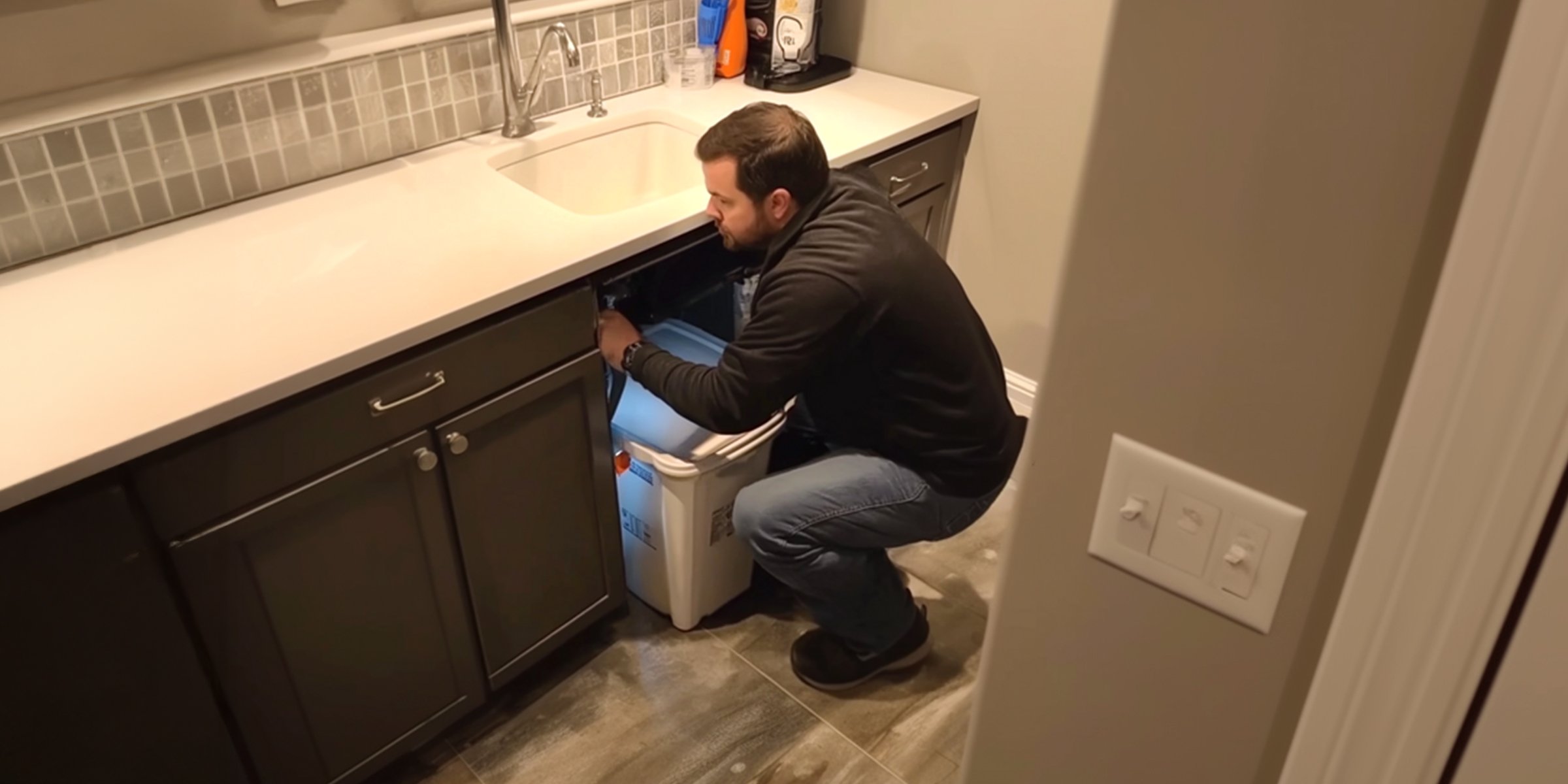 A man fixing a sink | Source: No source