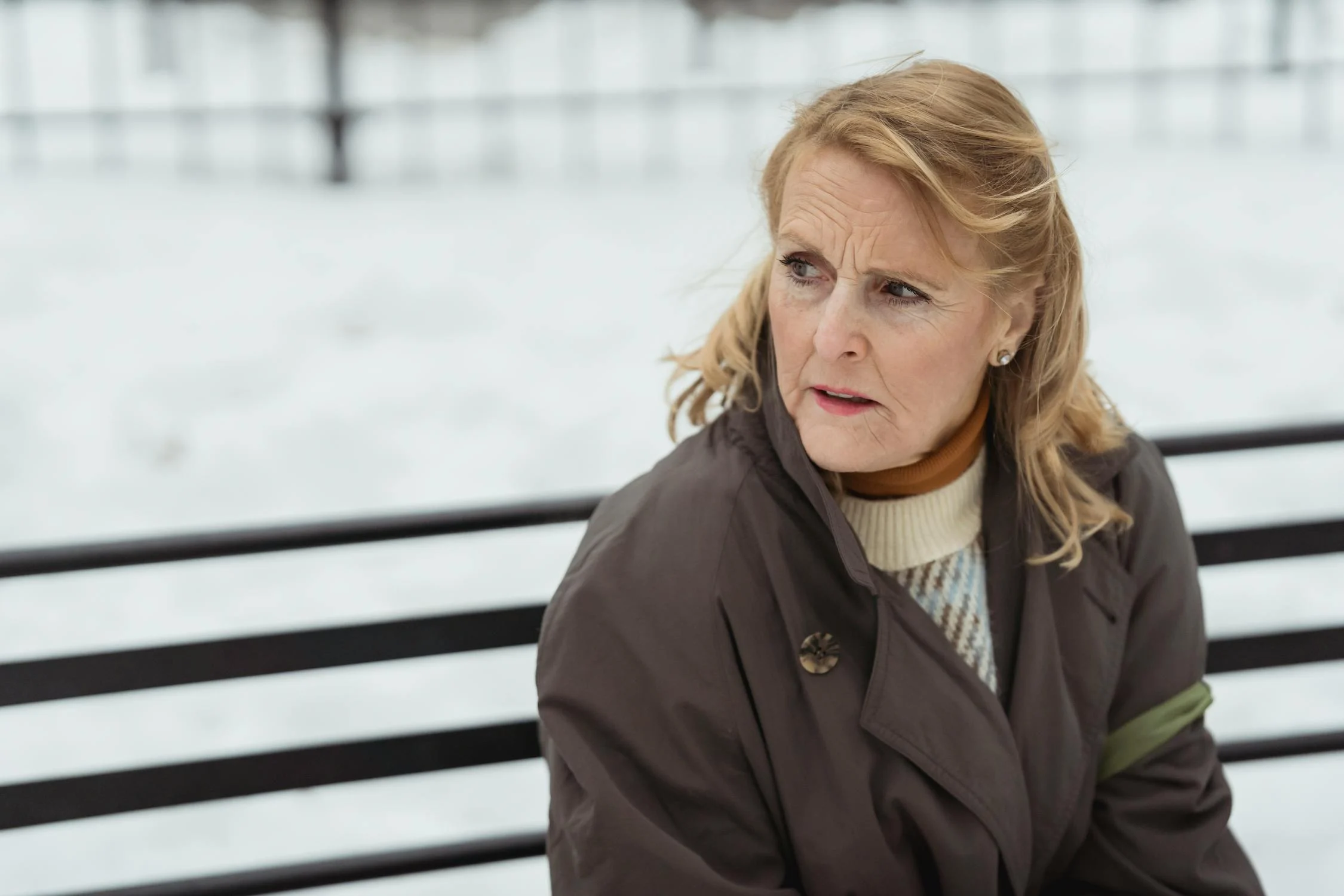 A woman sitting in her coat | Source: Pexels