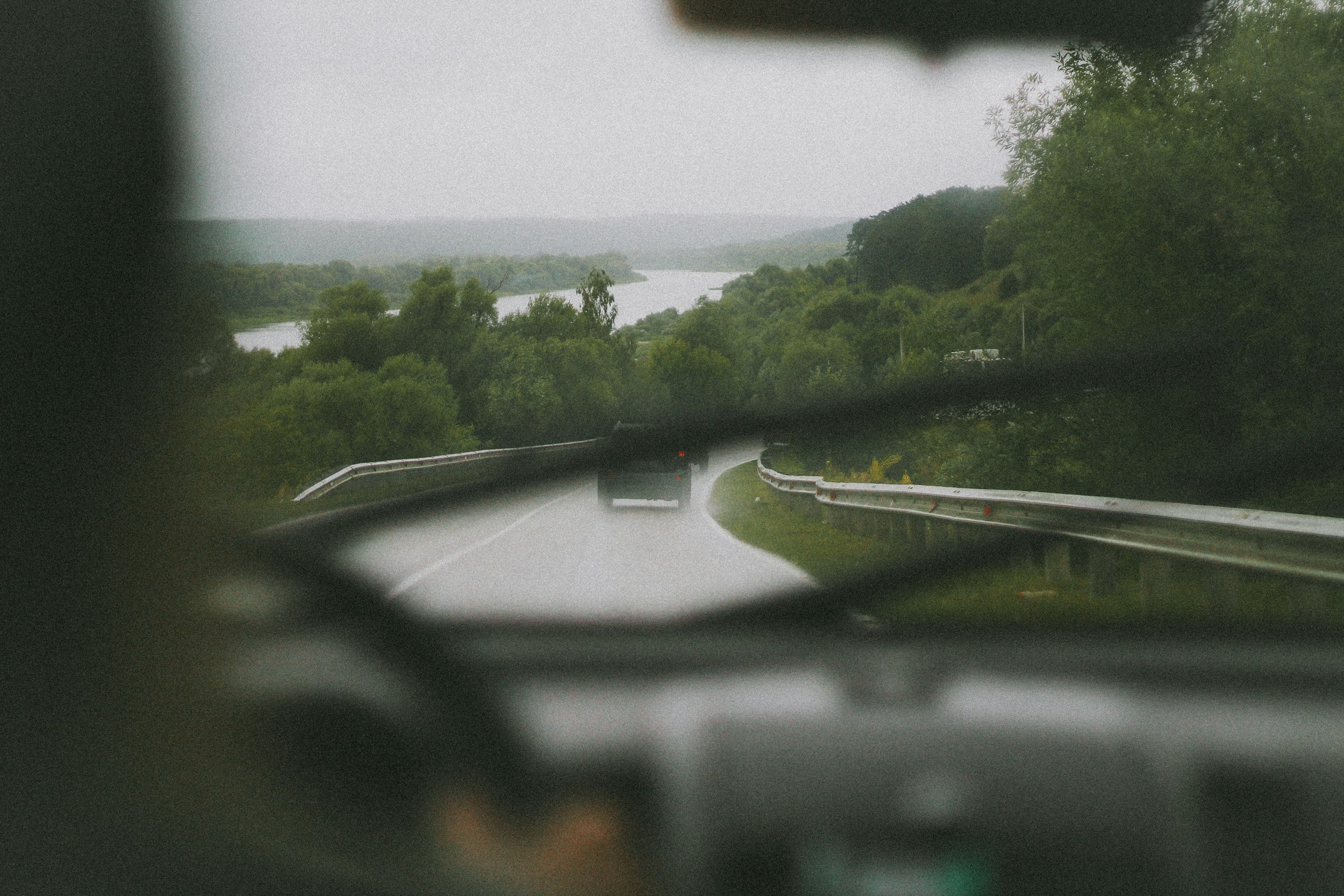 Driving through a road by a lake | Source: Unsplash
