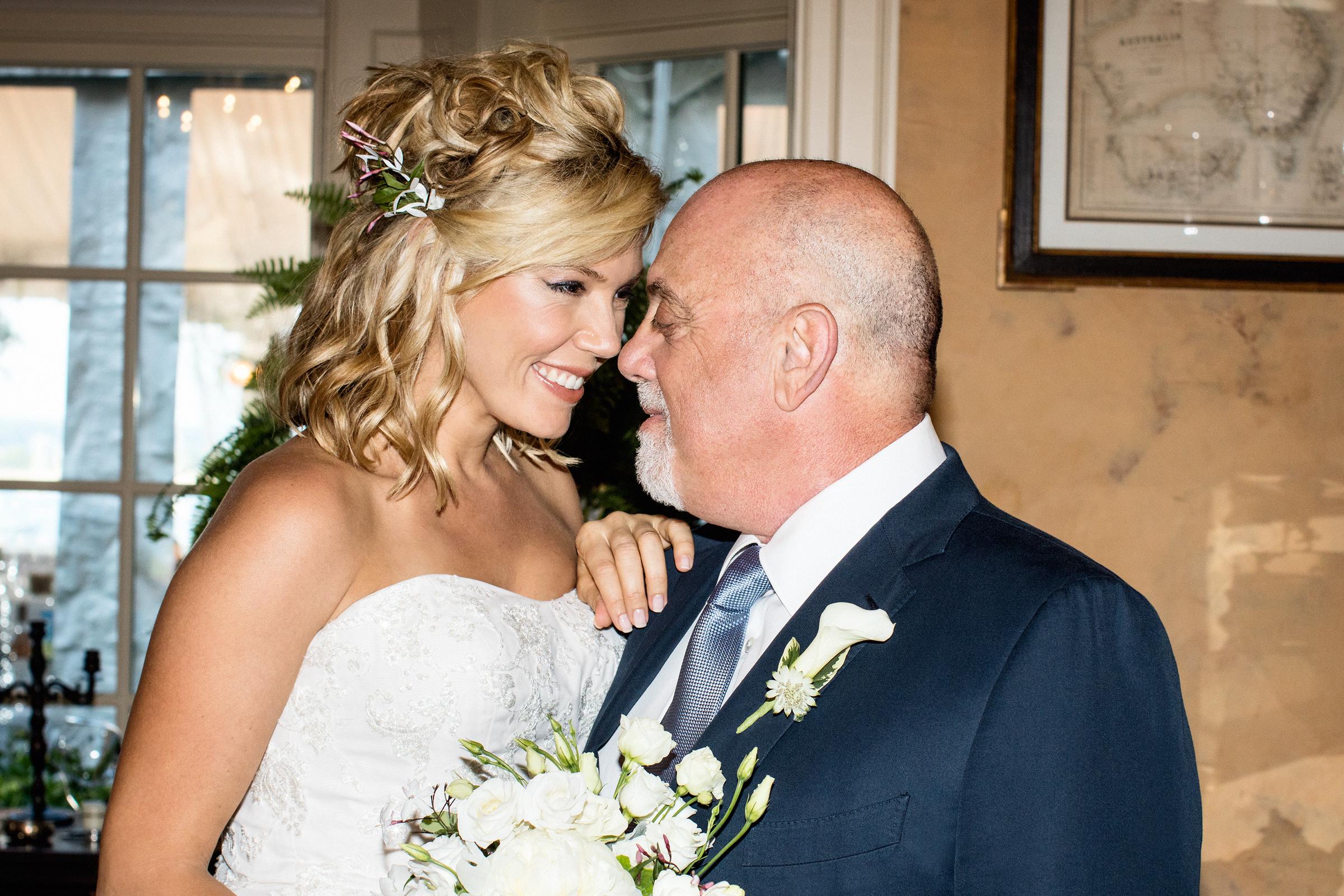 Alexis Roderick and Billy Joel are pictured on their wedding day at their estate in Long Island, on July 4, 2015 | Source: Getty Images