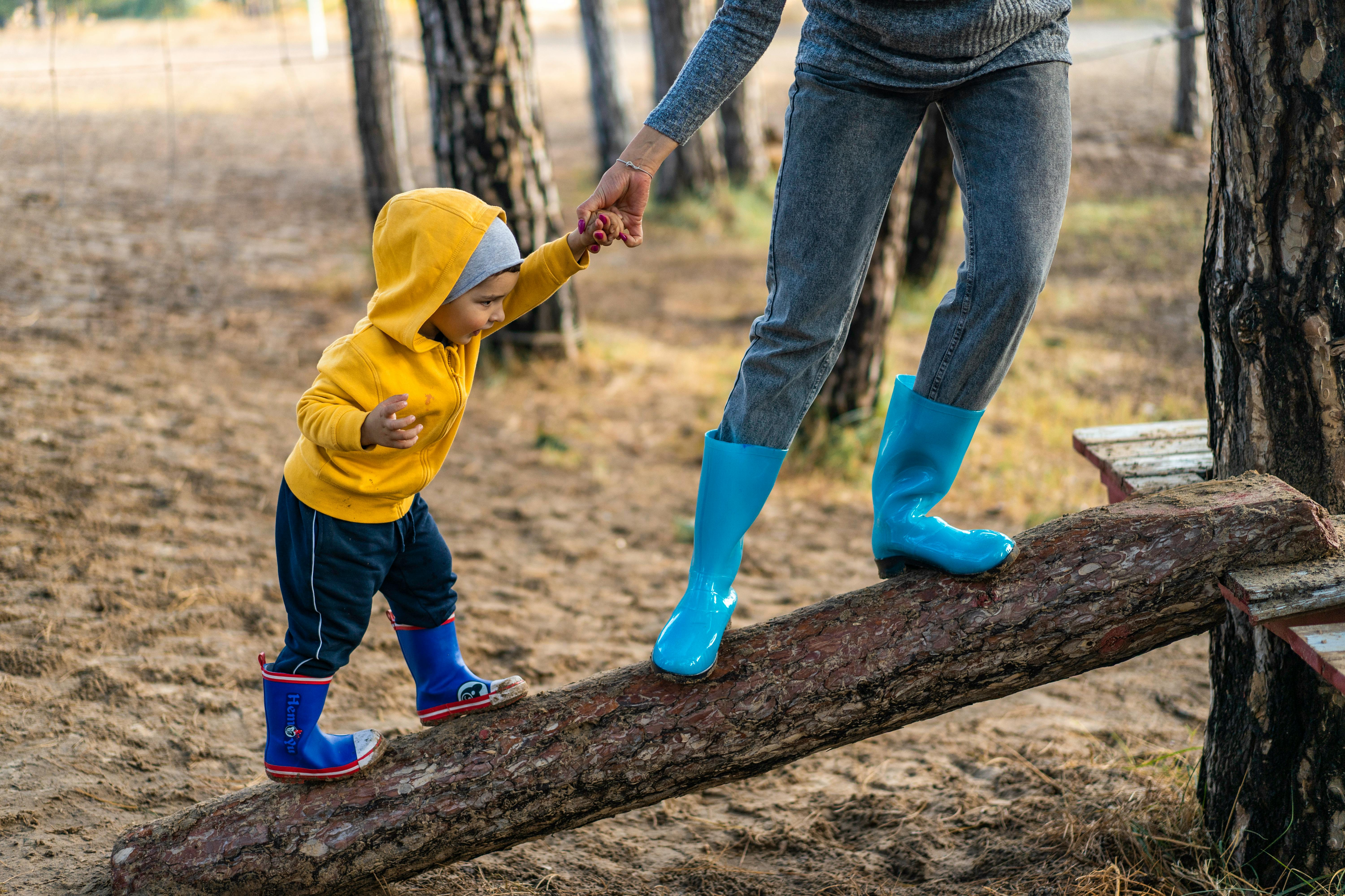 Woman and kid in the woods | Source: Pexels