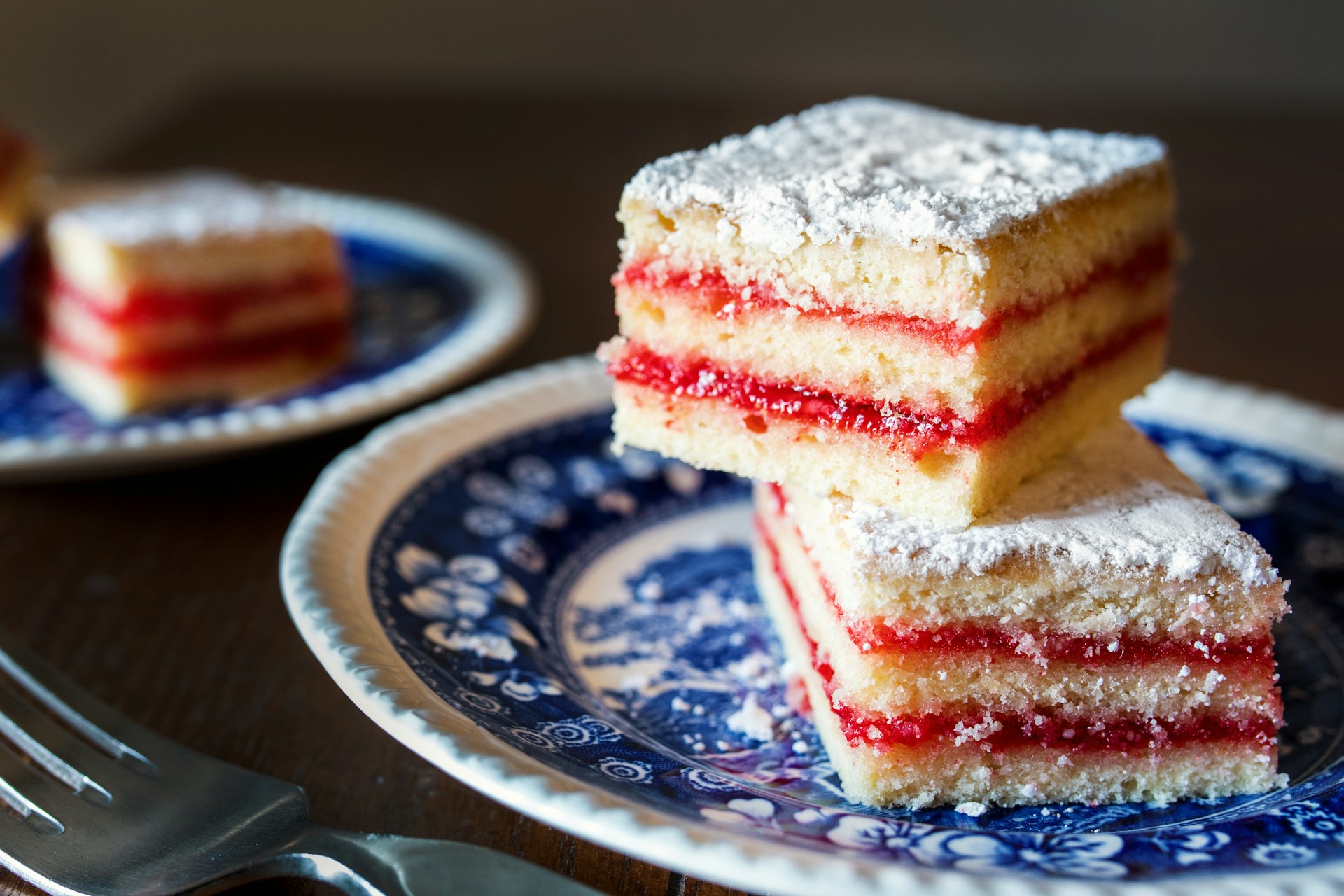 Slices of sheet cake on two plates | Source: Unsplash