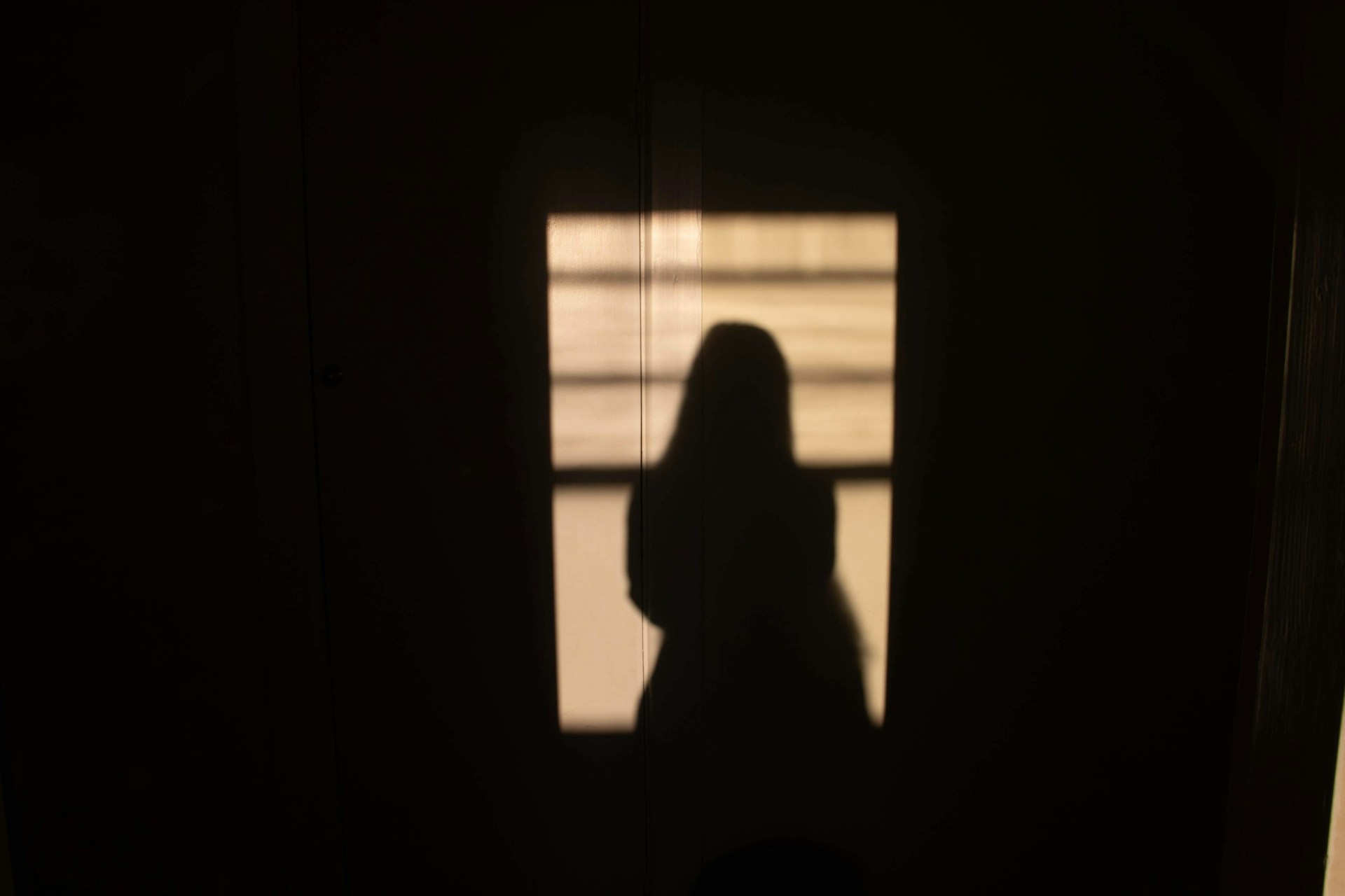 Silhouette of a woman's shadow | Source: Unsplash