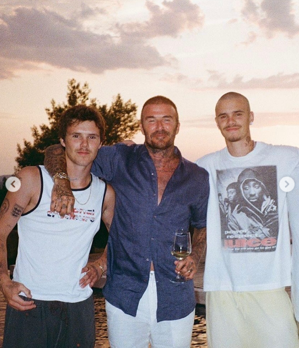 David, Cruz, and Romeo Beckham pose together during the summer in a post dated September 1, 2025 | Source: Instagram/victoriabeckham