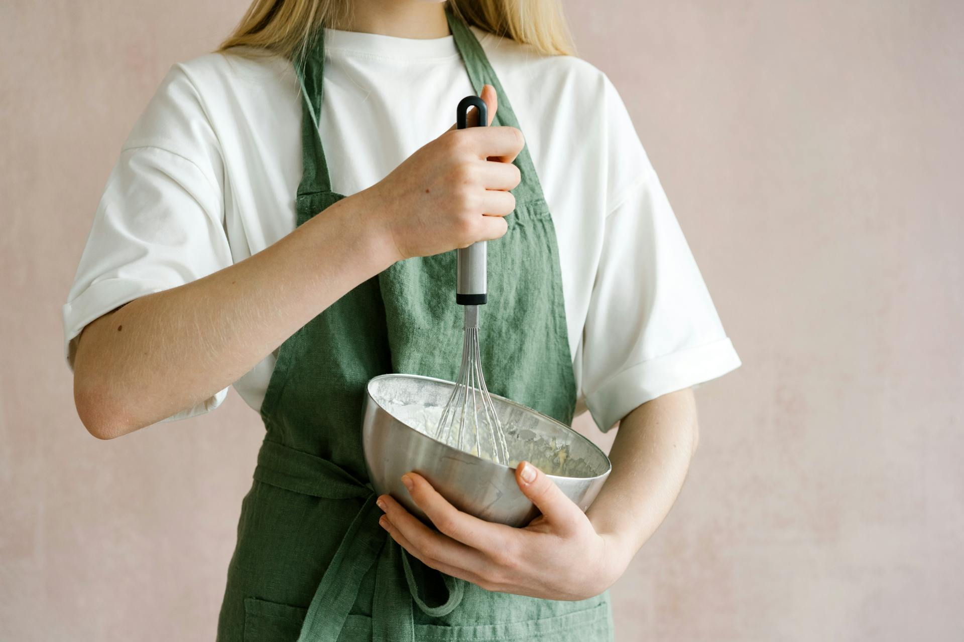 A woman mixing cake batter | Source: Pexels