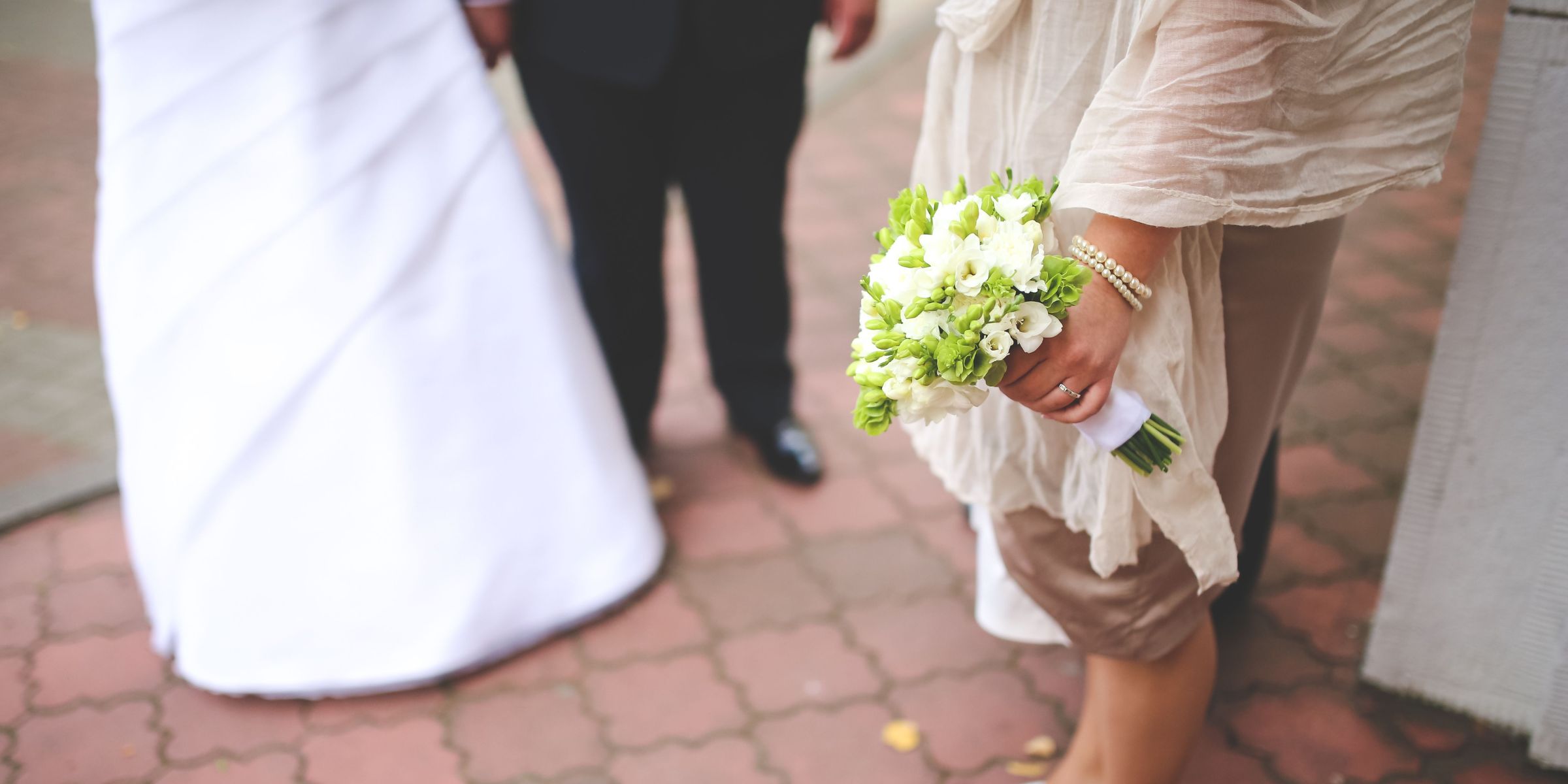 A bridesmaid holding a bouquet of flowers | Source: Pexels
