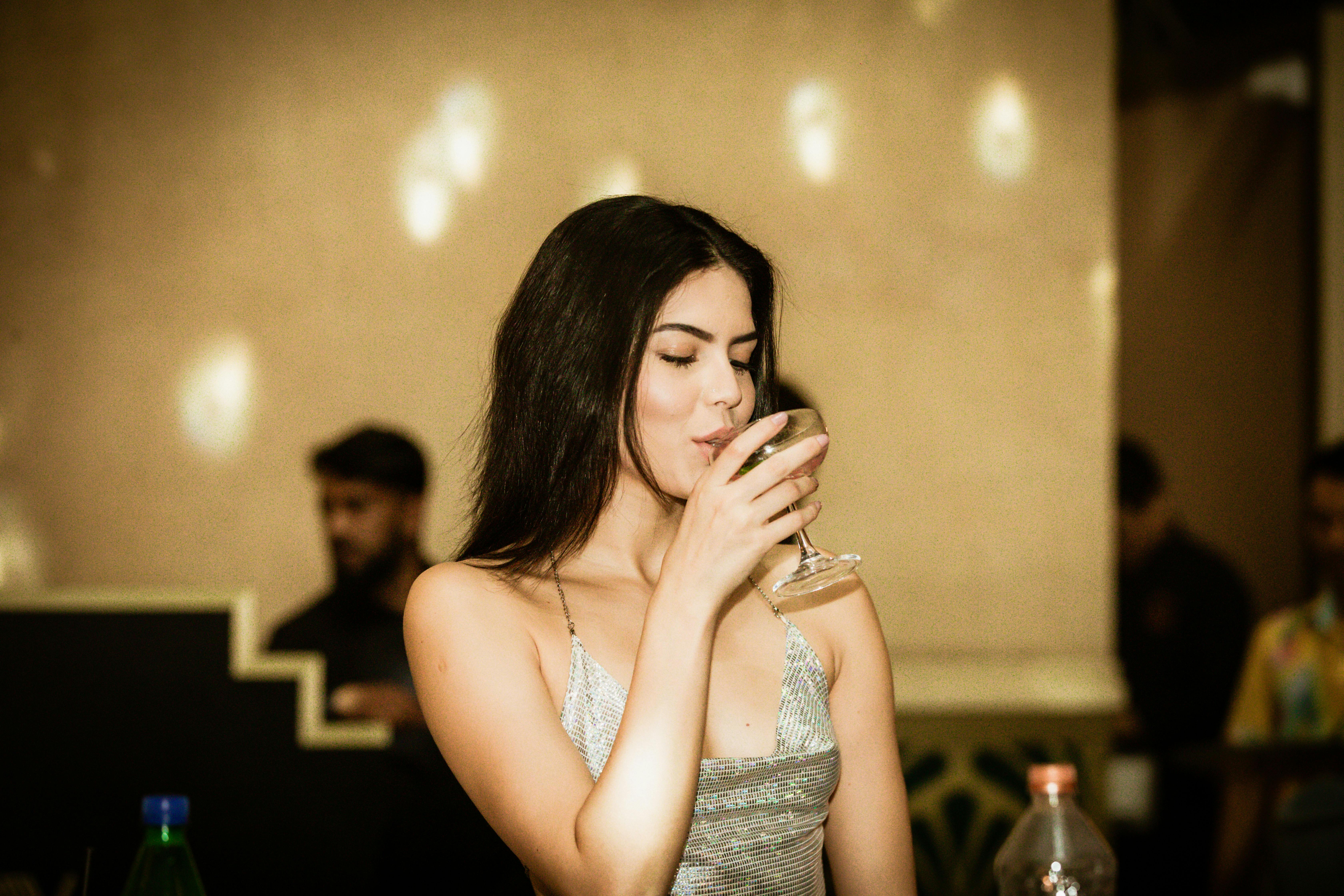 A happy woman enjoying her drink | Source: Pexels