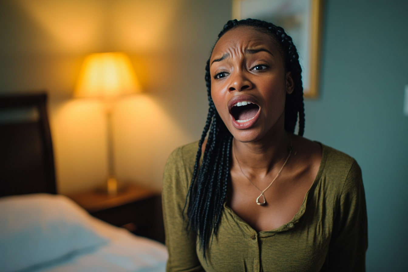 A stressed woman speaking to someone | Source: no source
