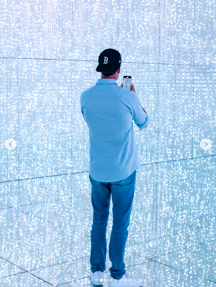 Tom Brady taking a photo inside what appears to be Tokyo's famed digital art museum. | Source: Instagram/tombrady