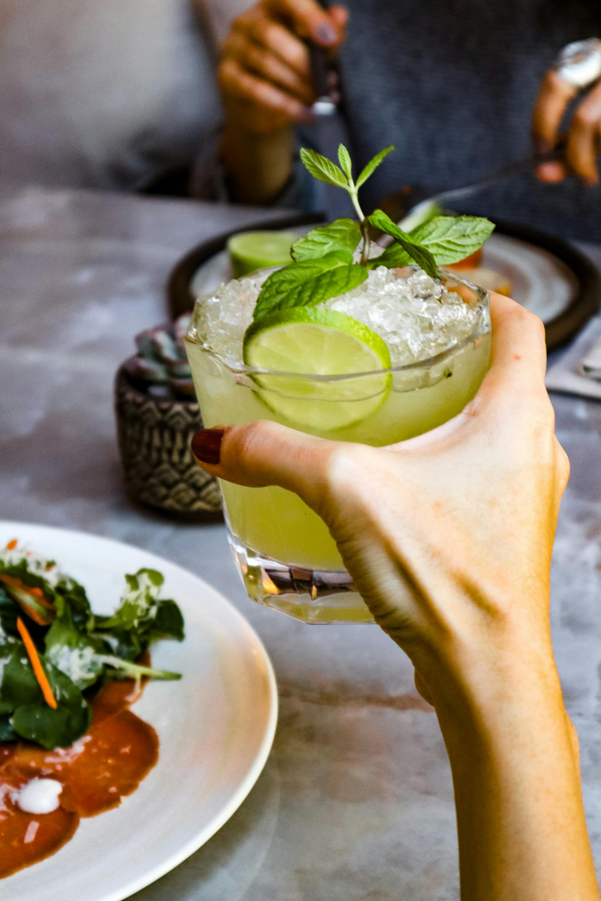 A woman holding a glass | Source: Pexels