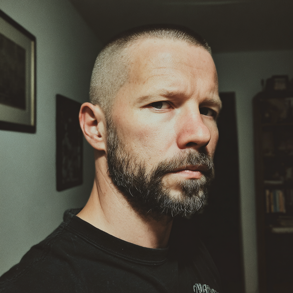 A stern man standing in a living room | Source: no source