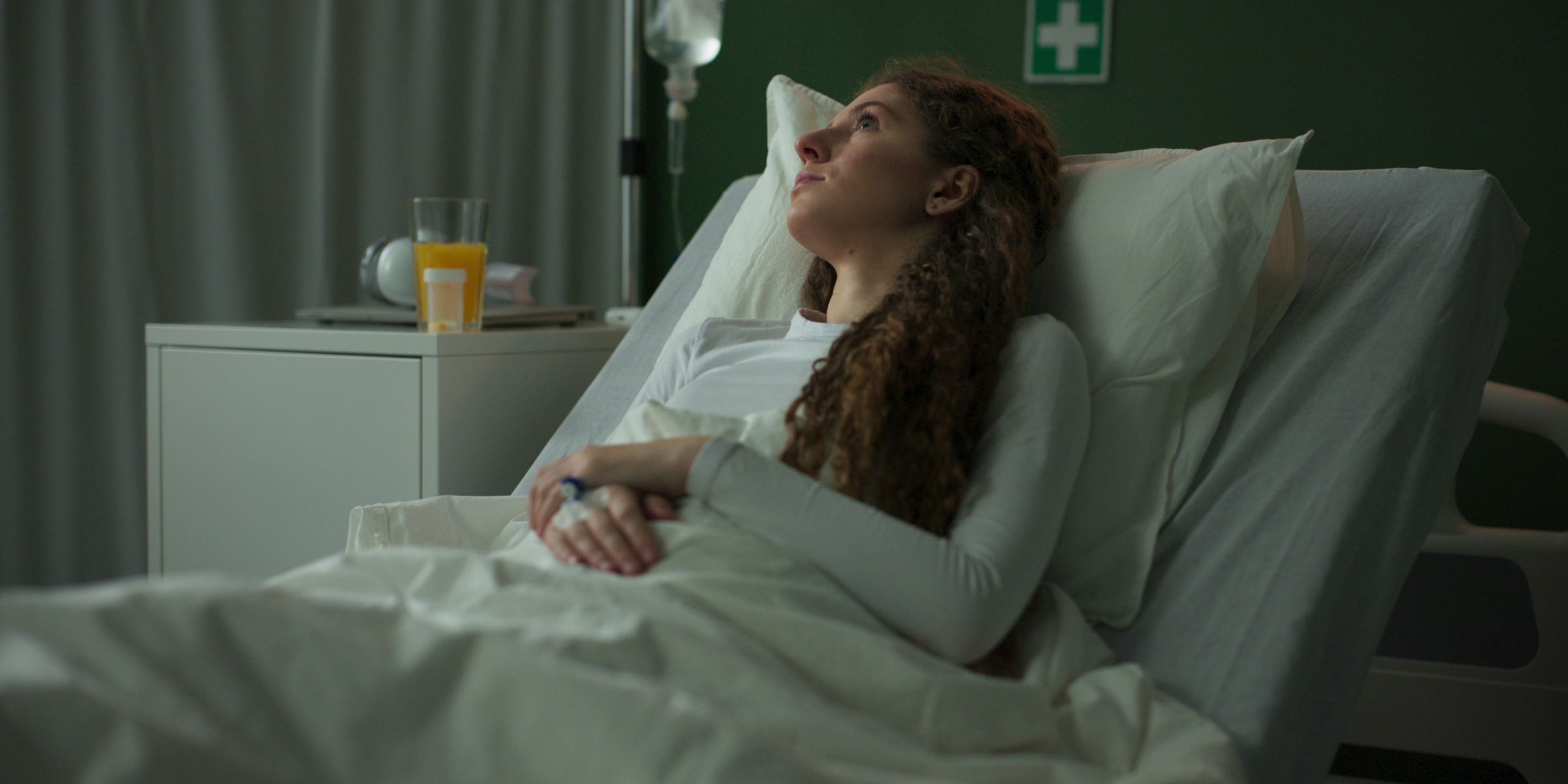 Hospitalized woman resting in bed | Source: Shutterstock