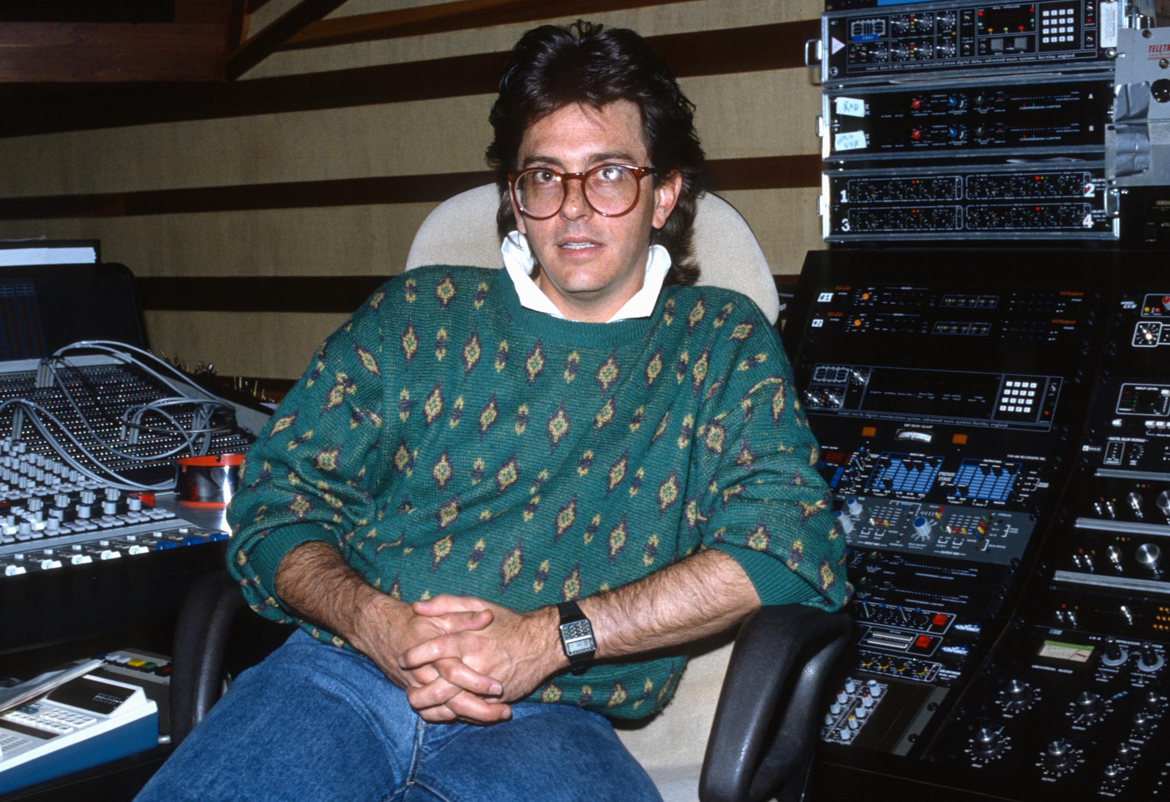 John Hughes poses in studio during the mixing of "The Breakfast Club" circa 1985 | Source: Getty Images
