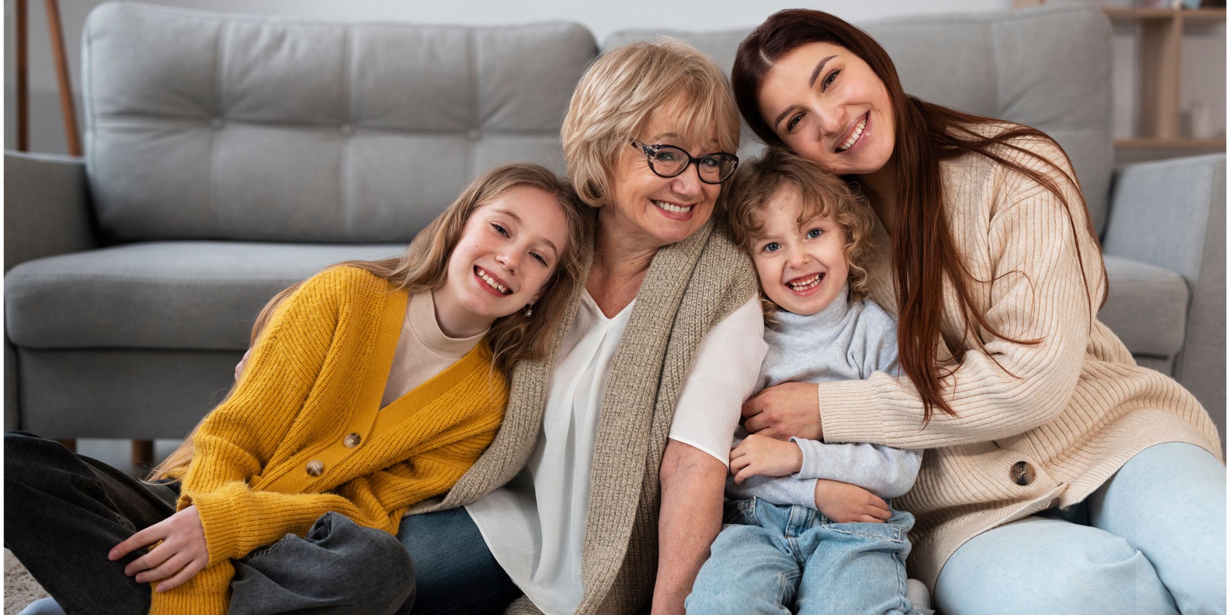 A happy family cuddled together on the floor | Source: No source